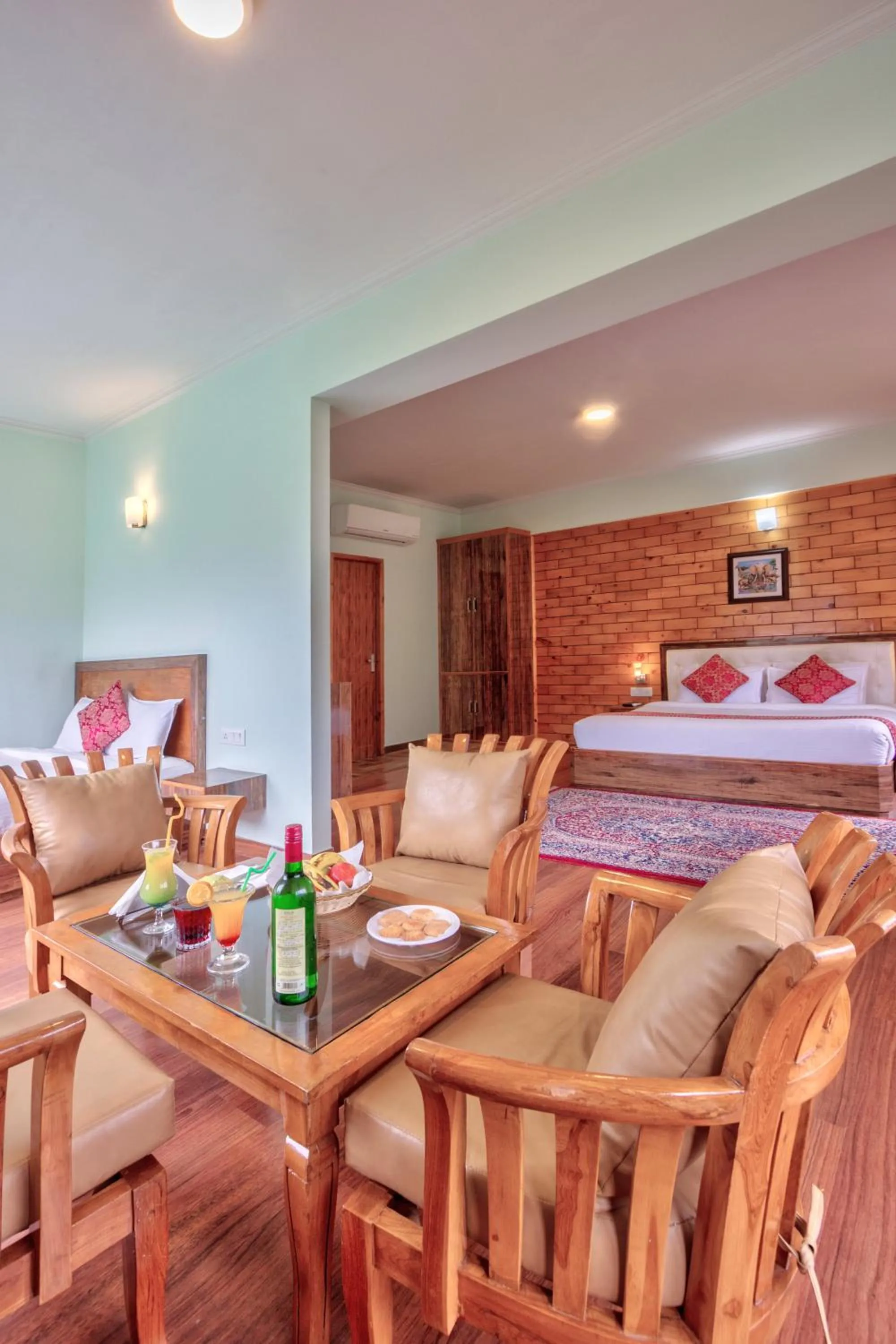 Seating area, Bed in Snow Flakes Resort And Spa Centrally Heated Luxury Resort