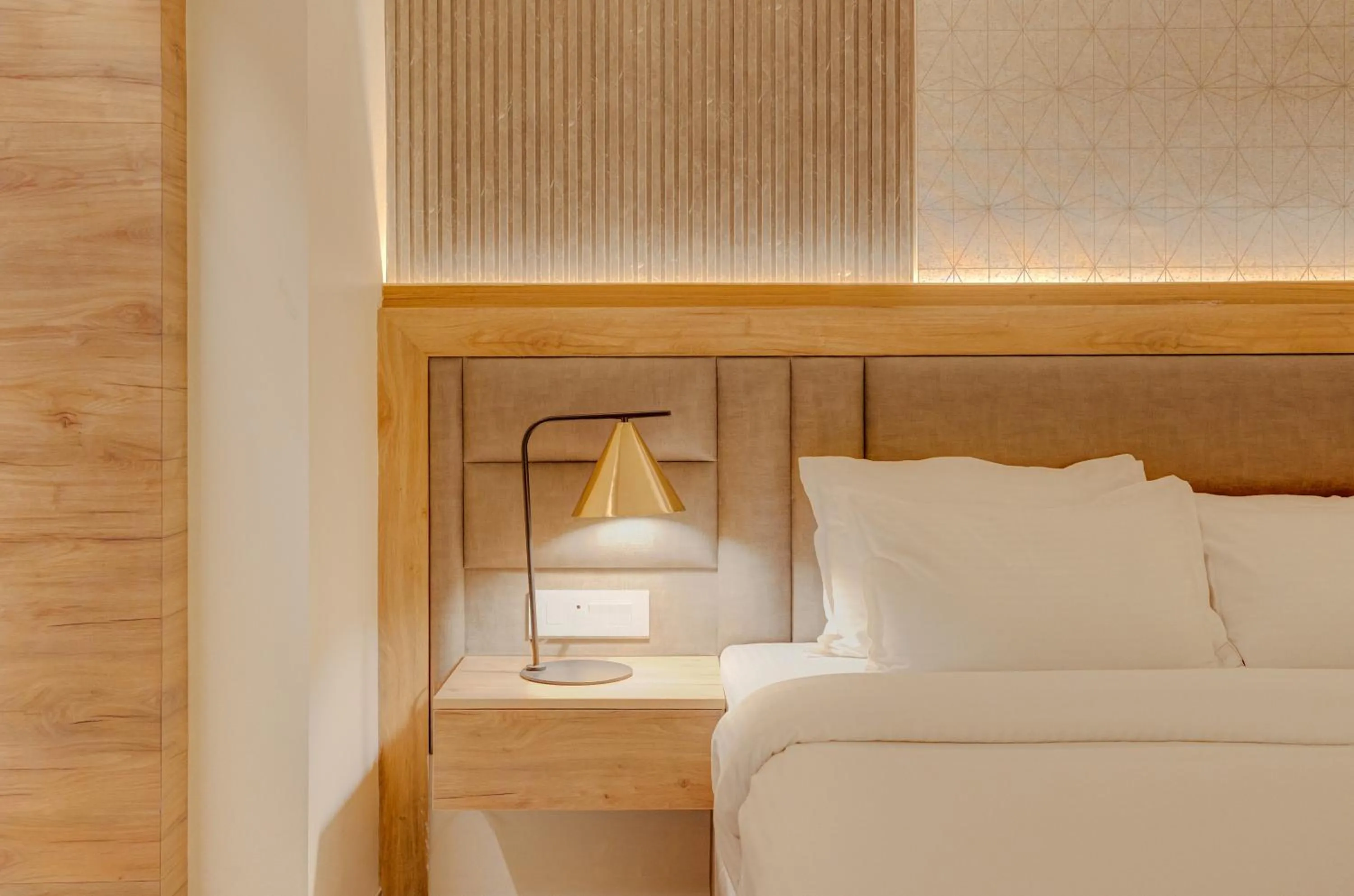 Bed in Hotel Vasundhara Palace