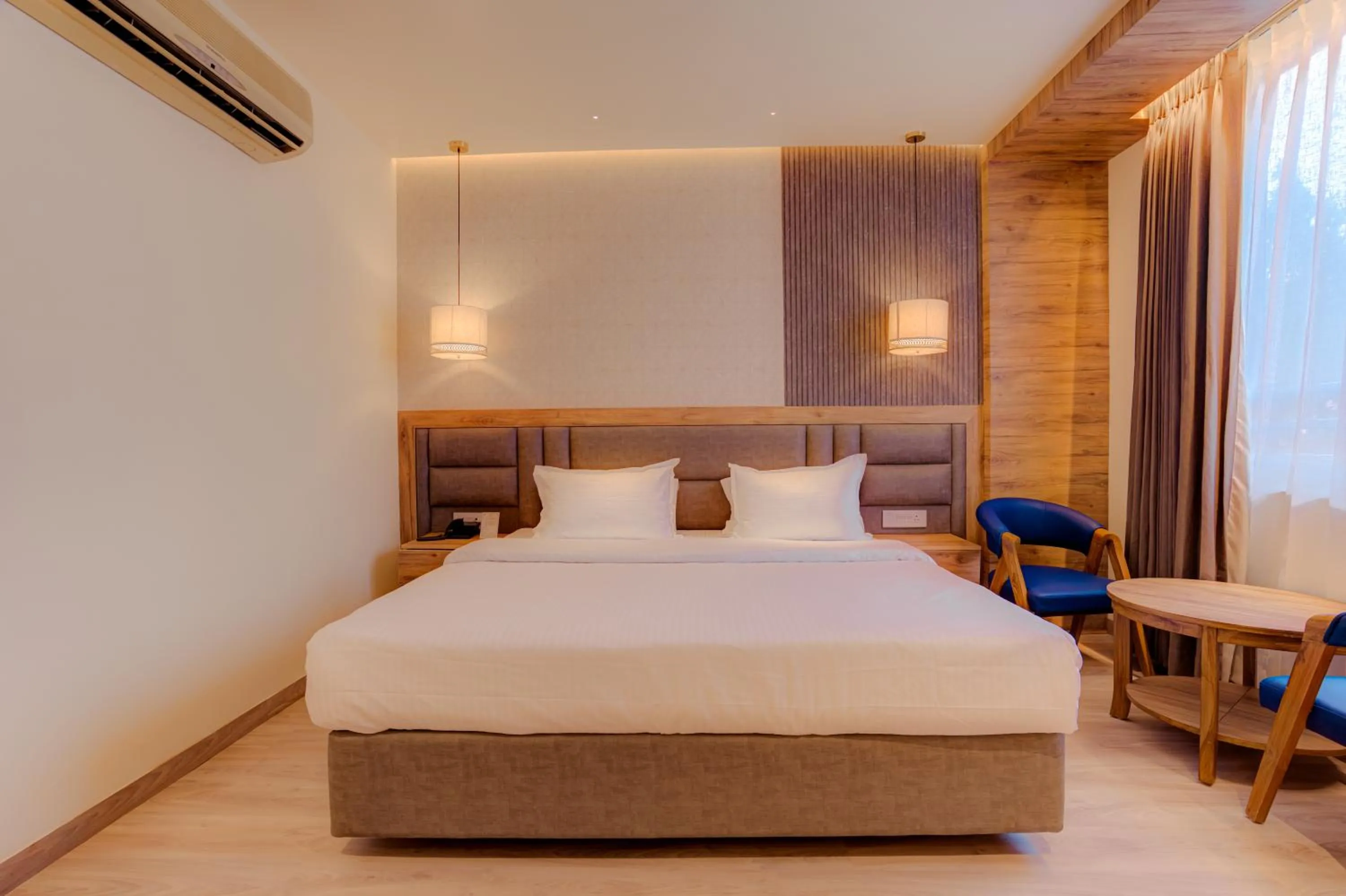 Bed in Hotel Vasundhara Palace