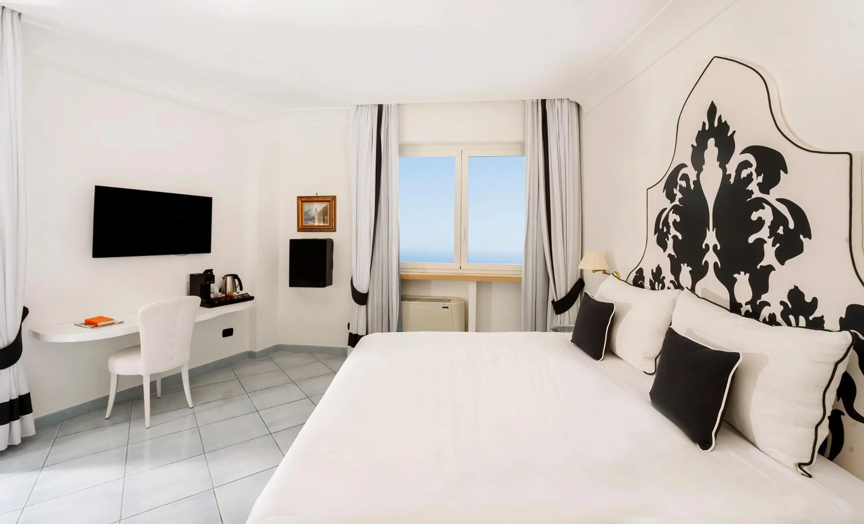 Bed in Hotel Le Agavi