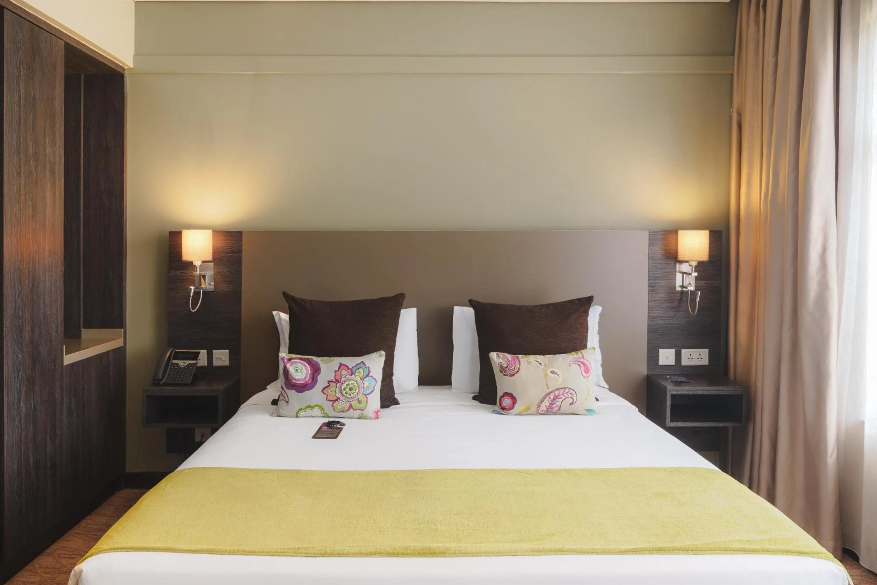 Bed in Tamarind Tree Hotel