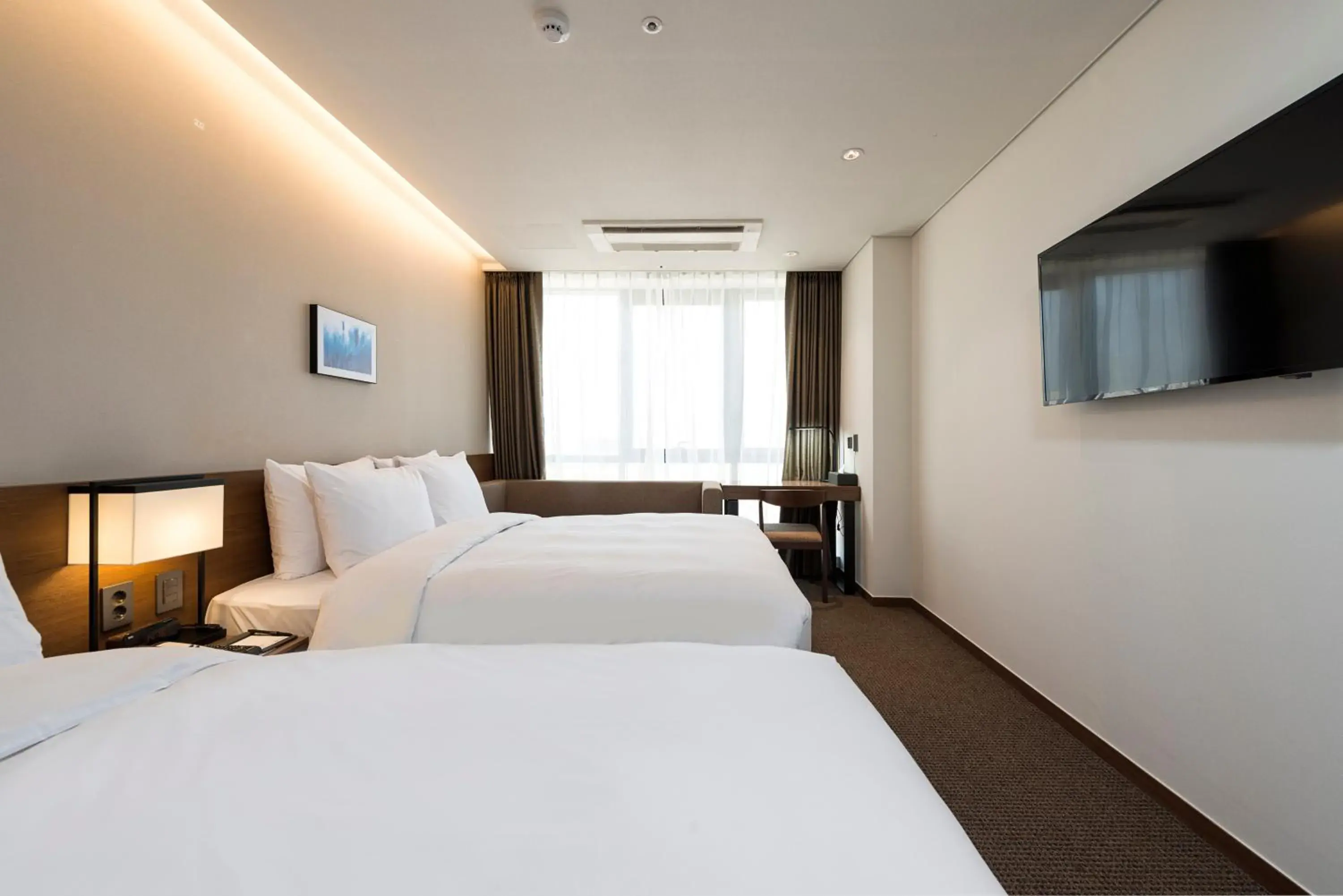 Bed in Ramada Encore by Wyndham Busan Haeundae Bed in Ramada Encore by Wyndham Busan Haeundae