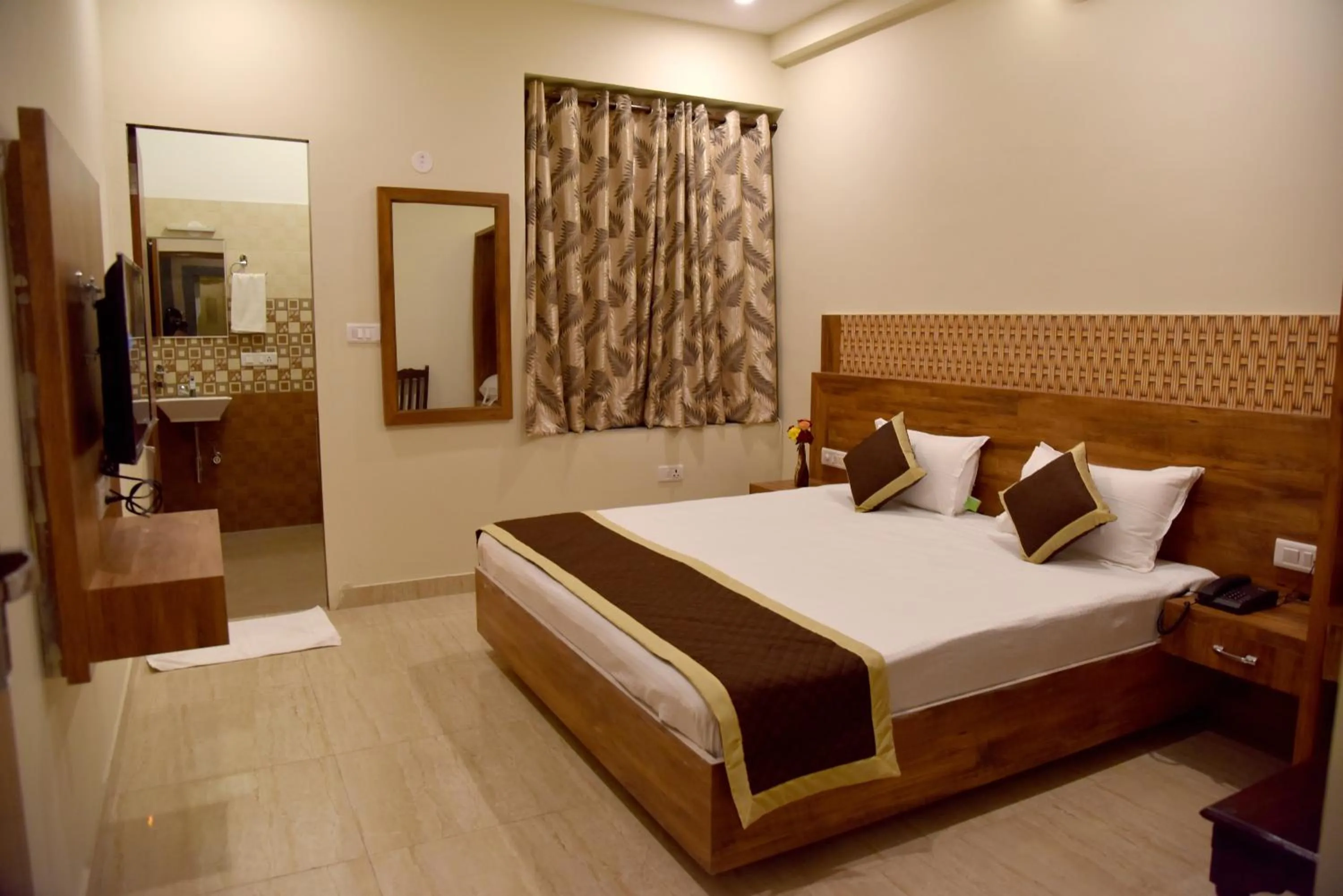 Photo of the whole room, Bed in Hotel Triveni Residency