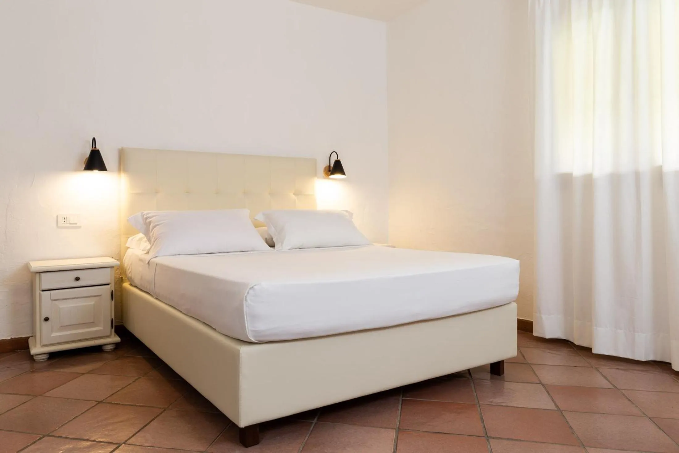 Bed in La Jacia Hotel & Resort
