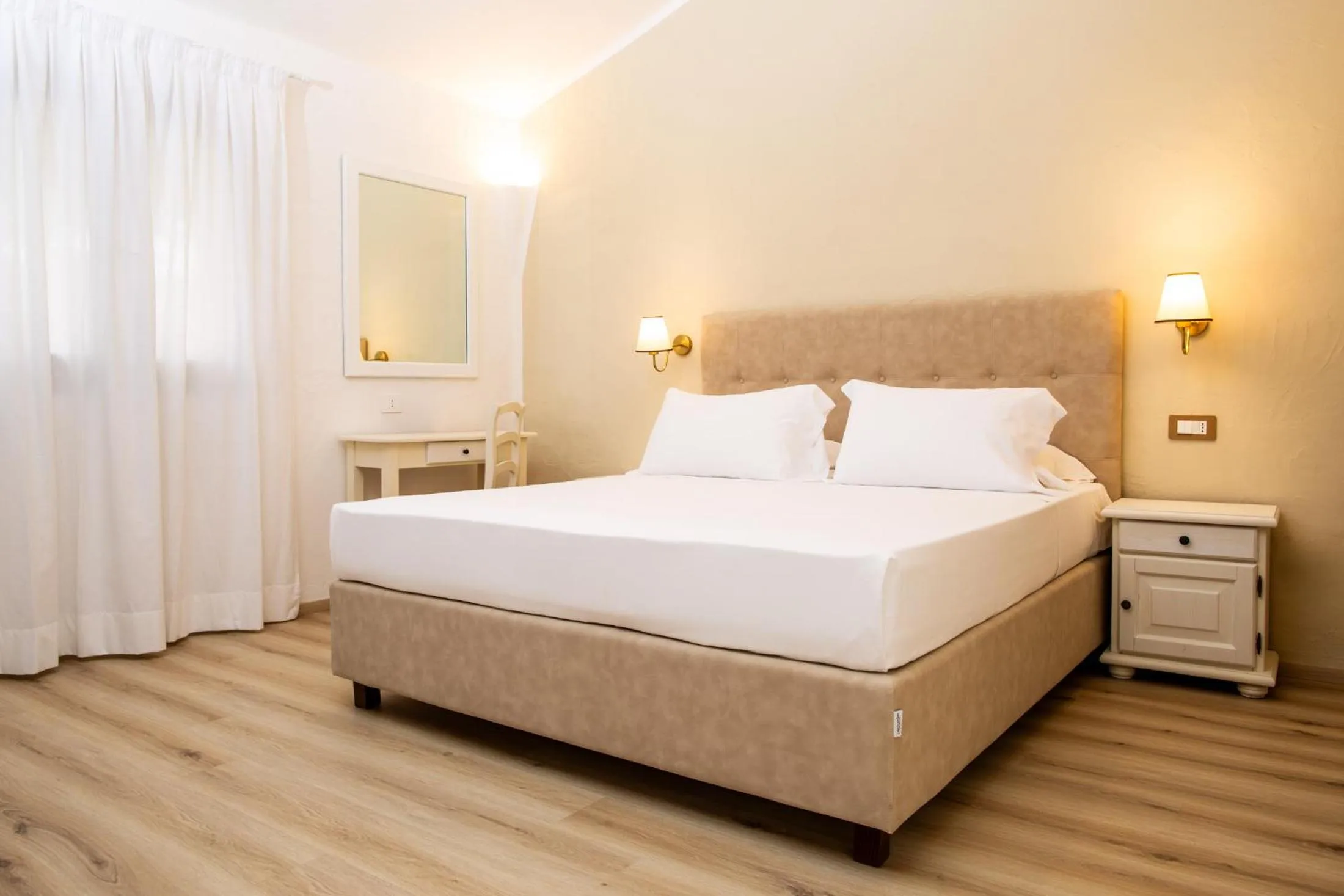 Bed in La Jacia Hotel & Resort