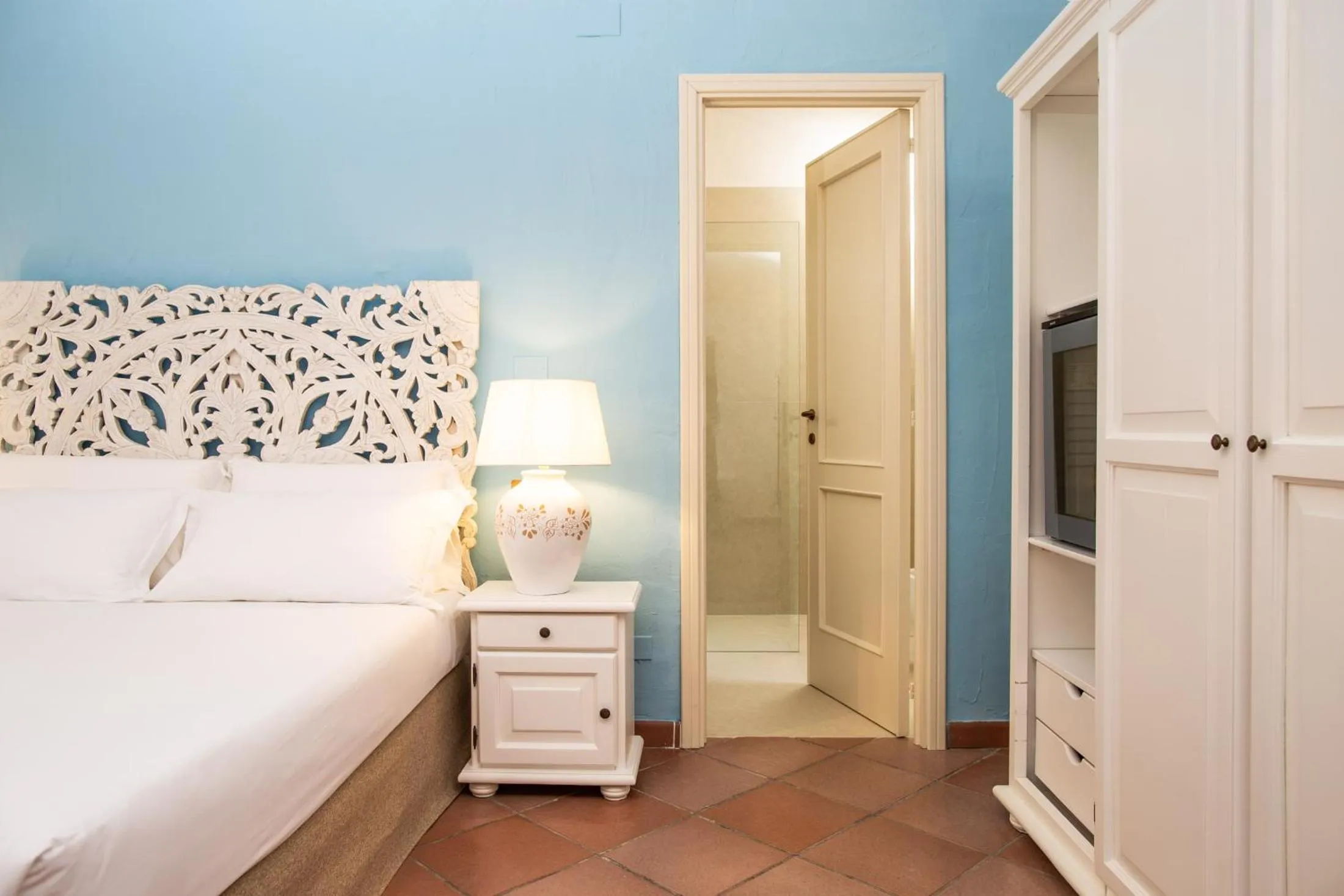 Bed in La Jacia Hotel & Resort