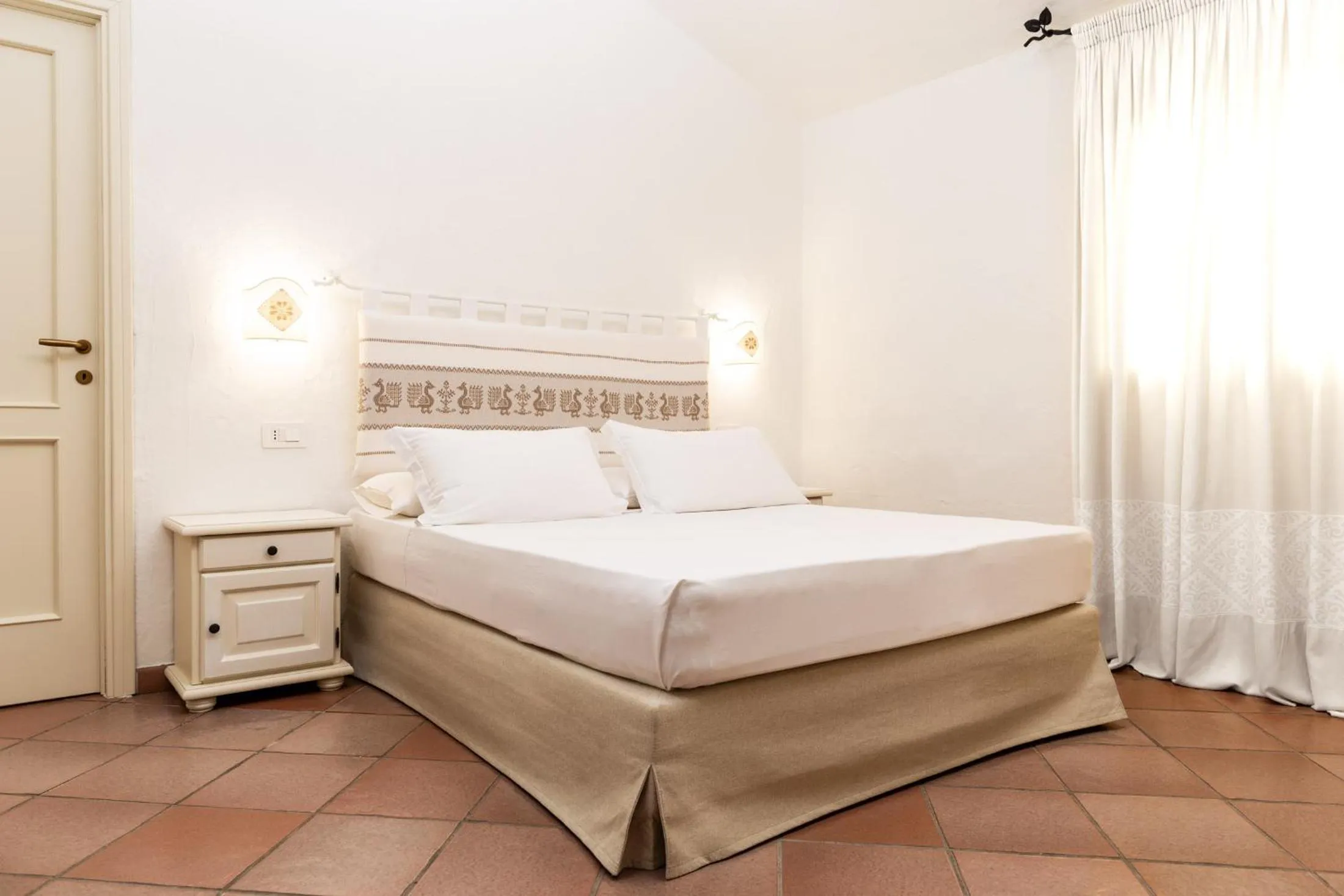 Bed in La Jacia Hotel & Resort