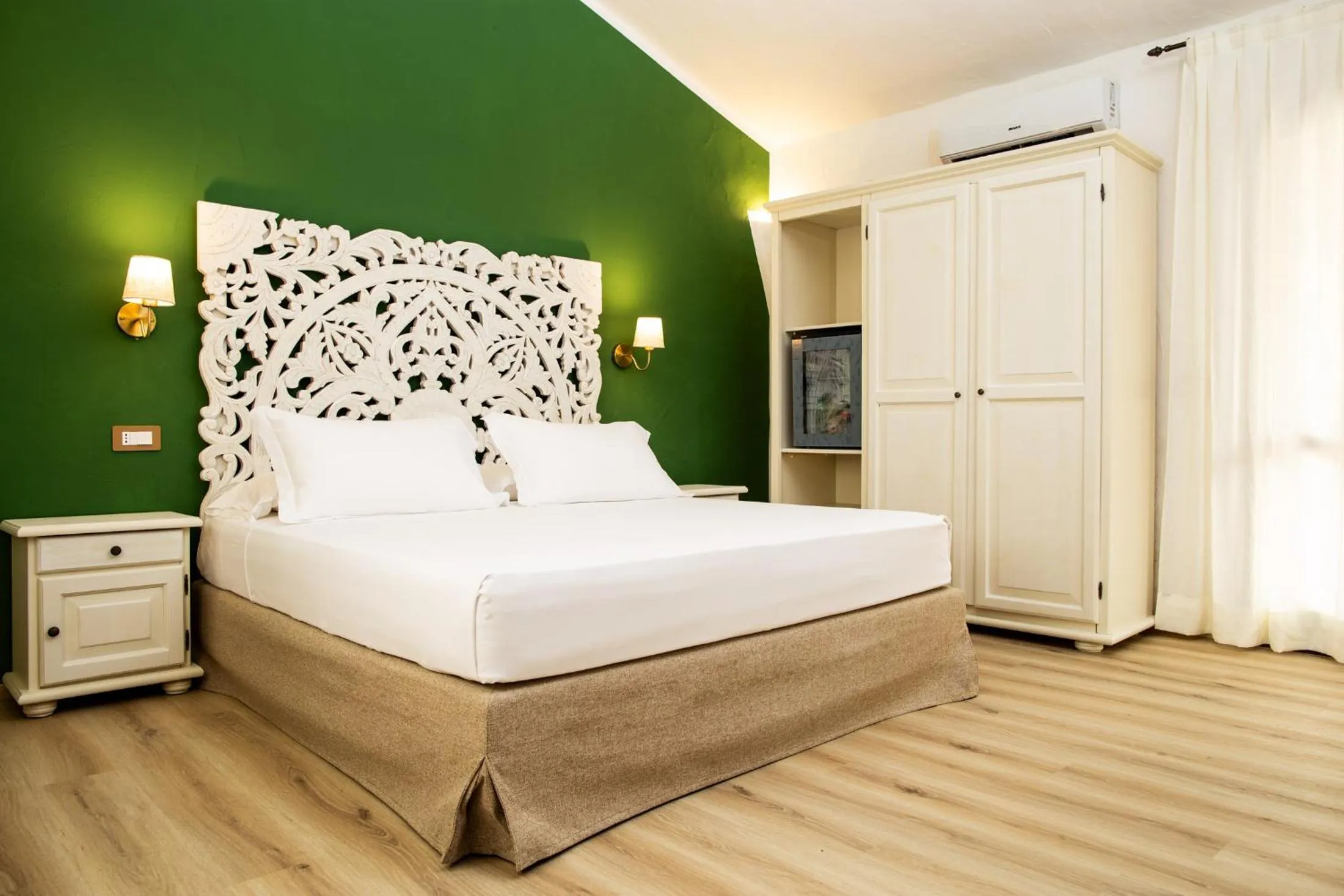 Bed in La Jacia Hotel & Resort