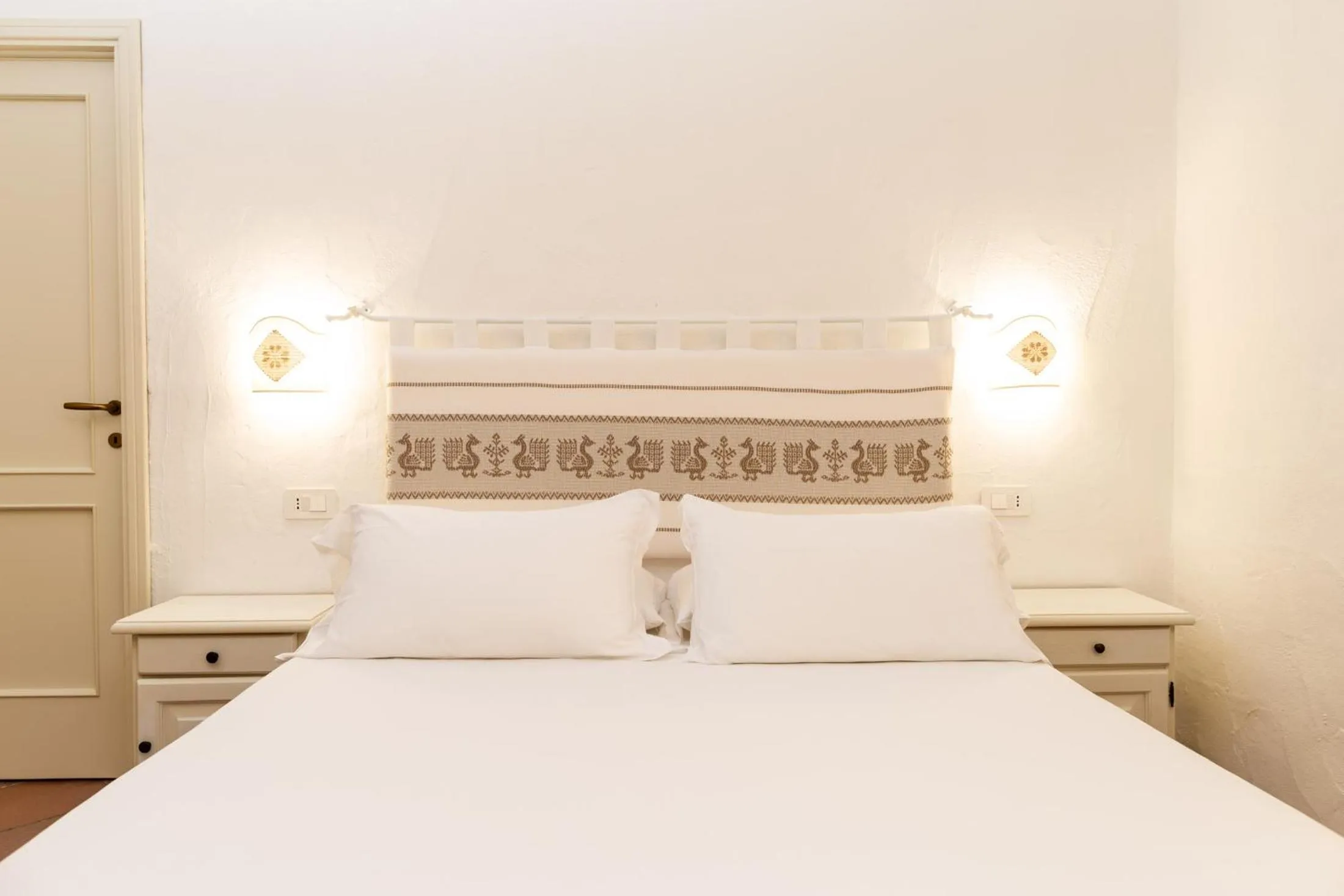 Bed in La Jacia Hotel & Resort