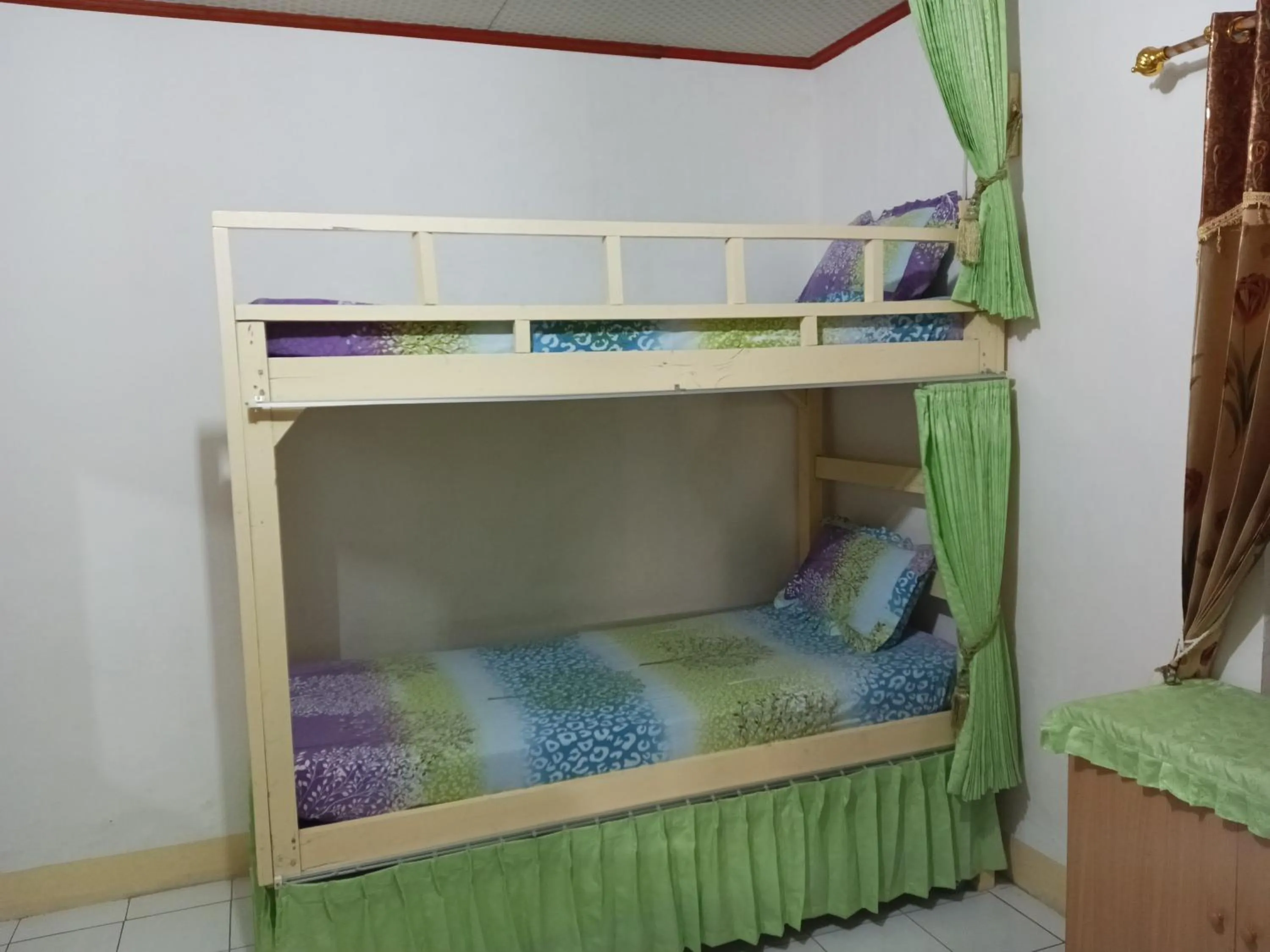 Bed in 4-Bed Female Dormitory Room in MJR Ticketing Guest House