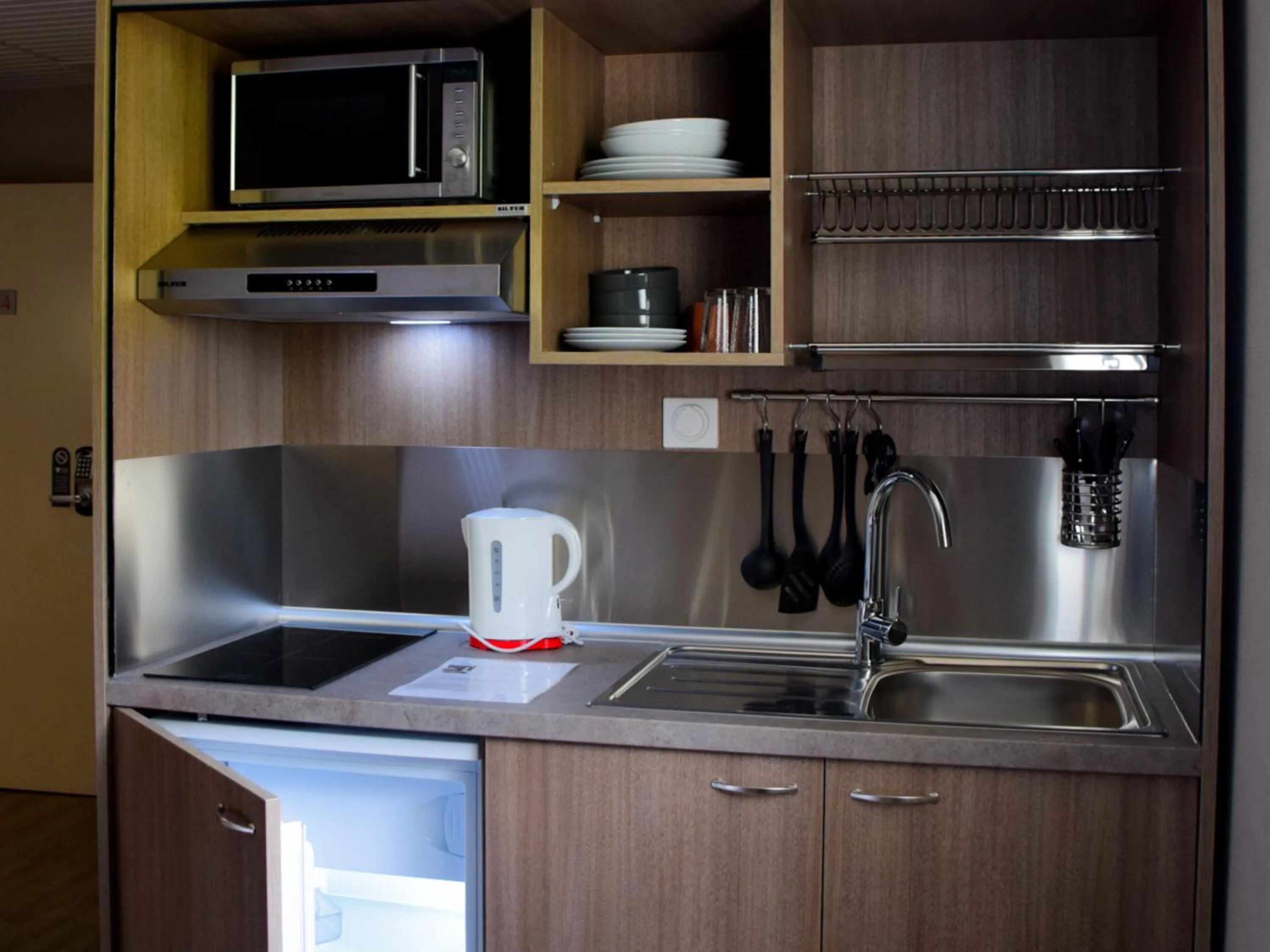 Kitchen or kitchenette in B&B HOTEL Aurillac Le Lioran