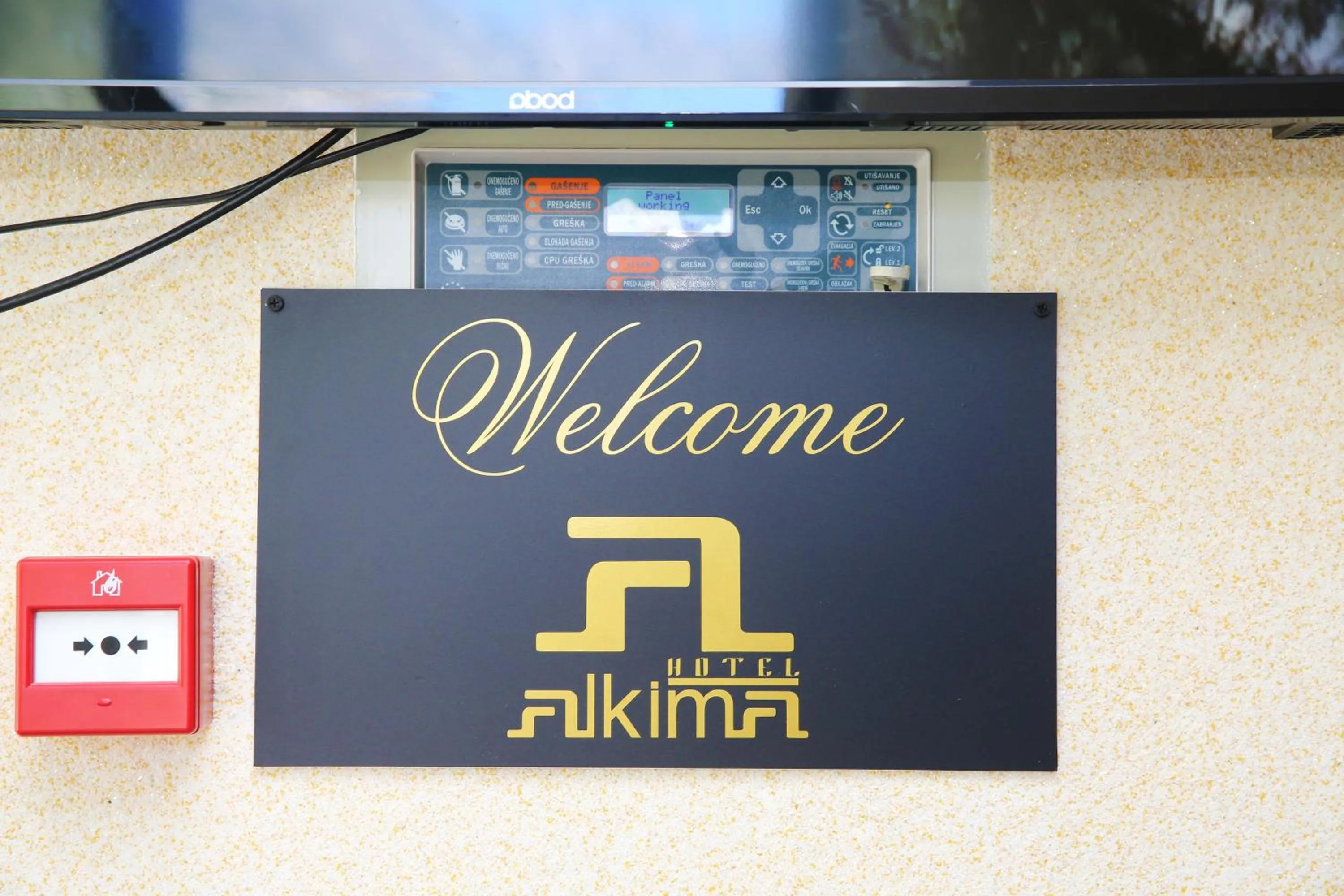 Property logo or sign in Hotel Alkima
