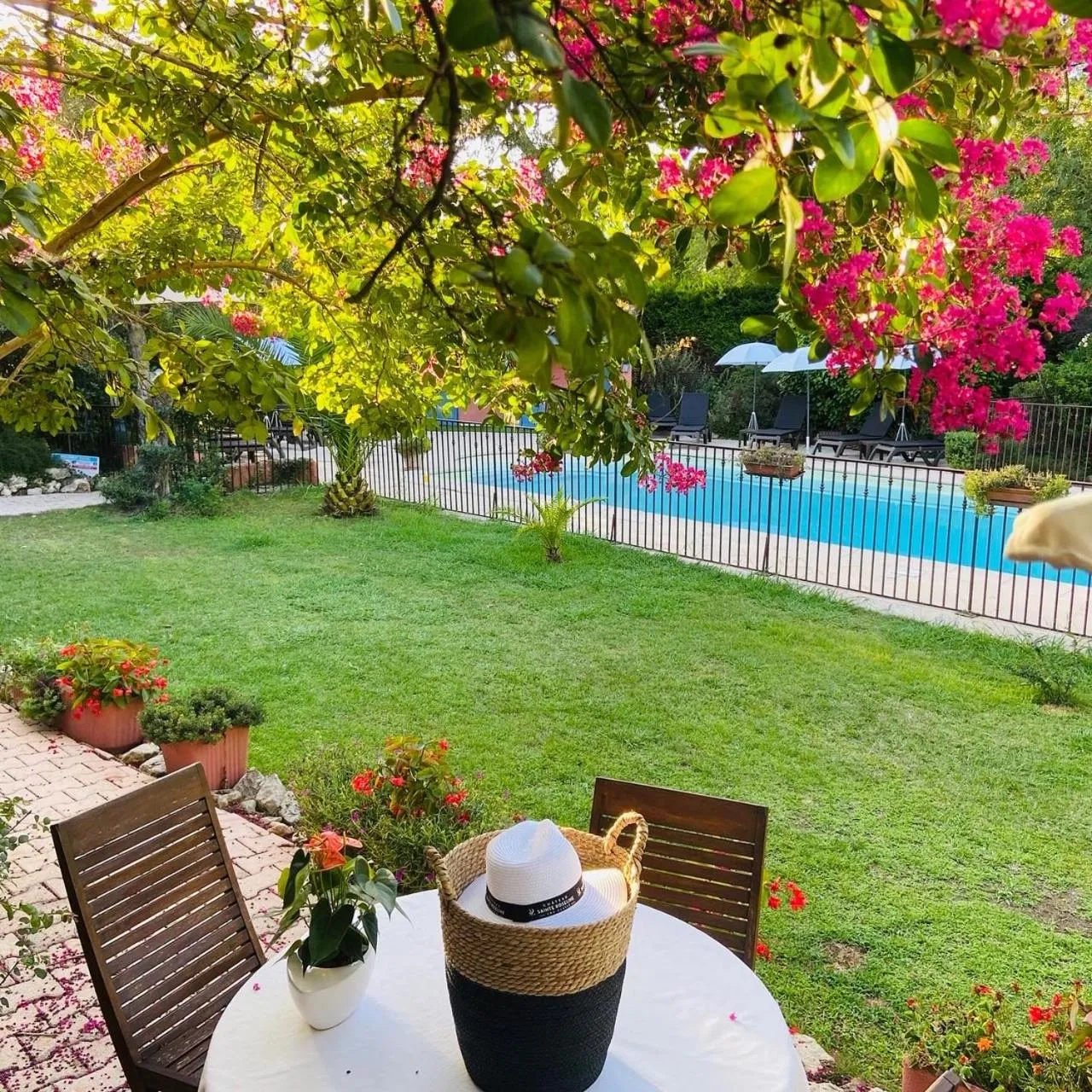 Garden in Logis Hôtels La Bastide des Golfs