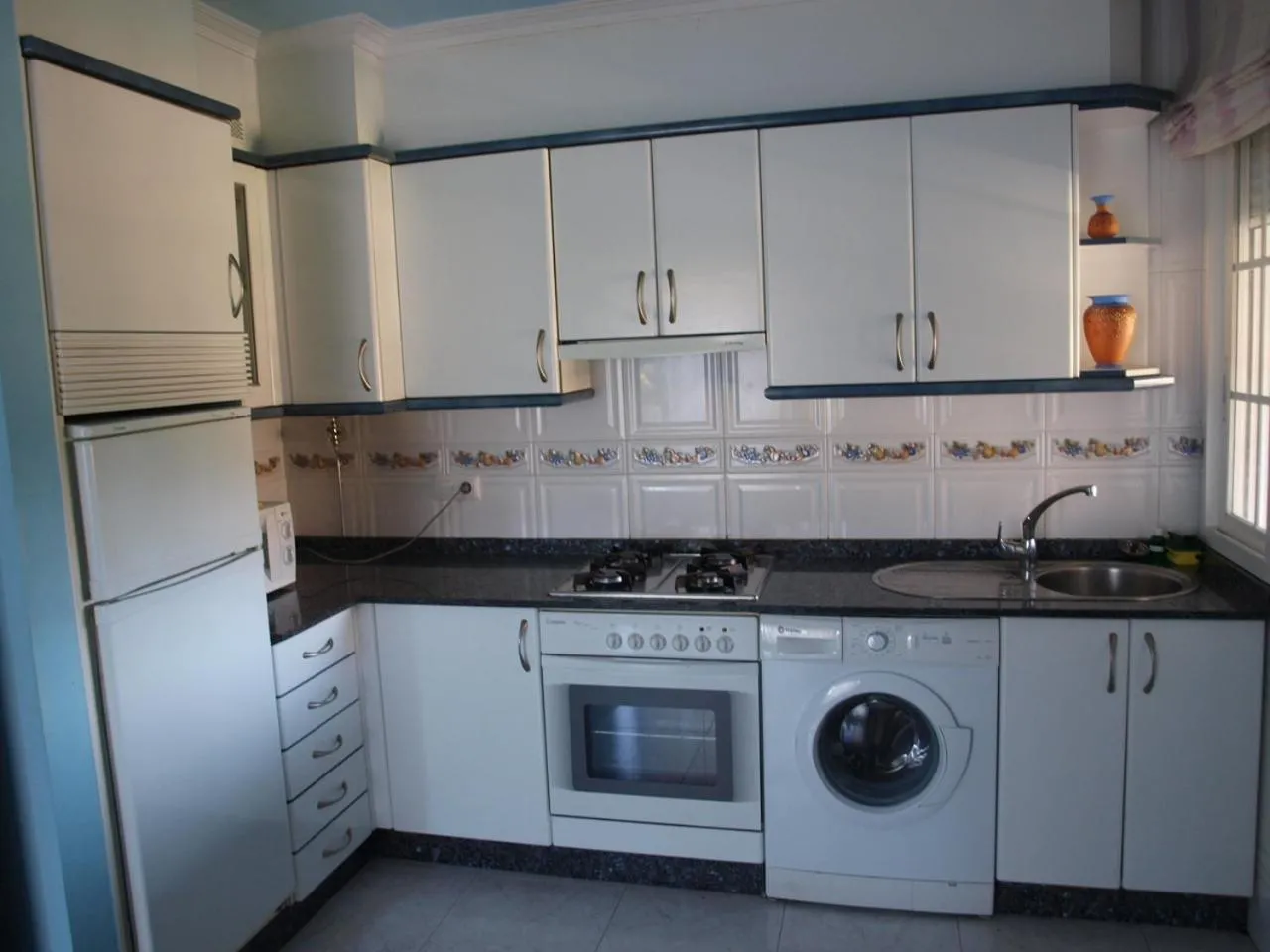 Kitchen or kitchenette in Chan da Vella