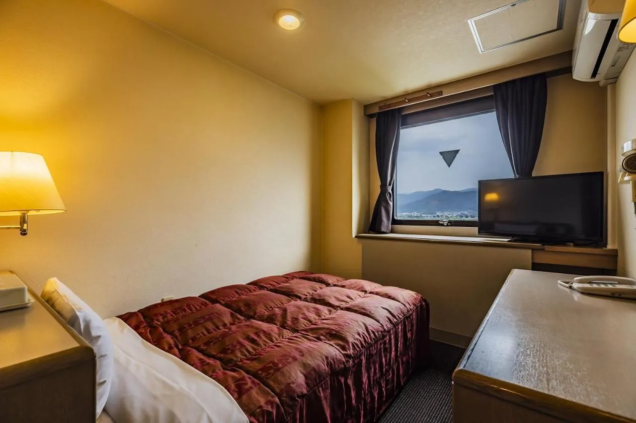 Bed in Asahi Century Hotel