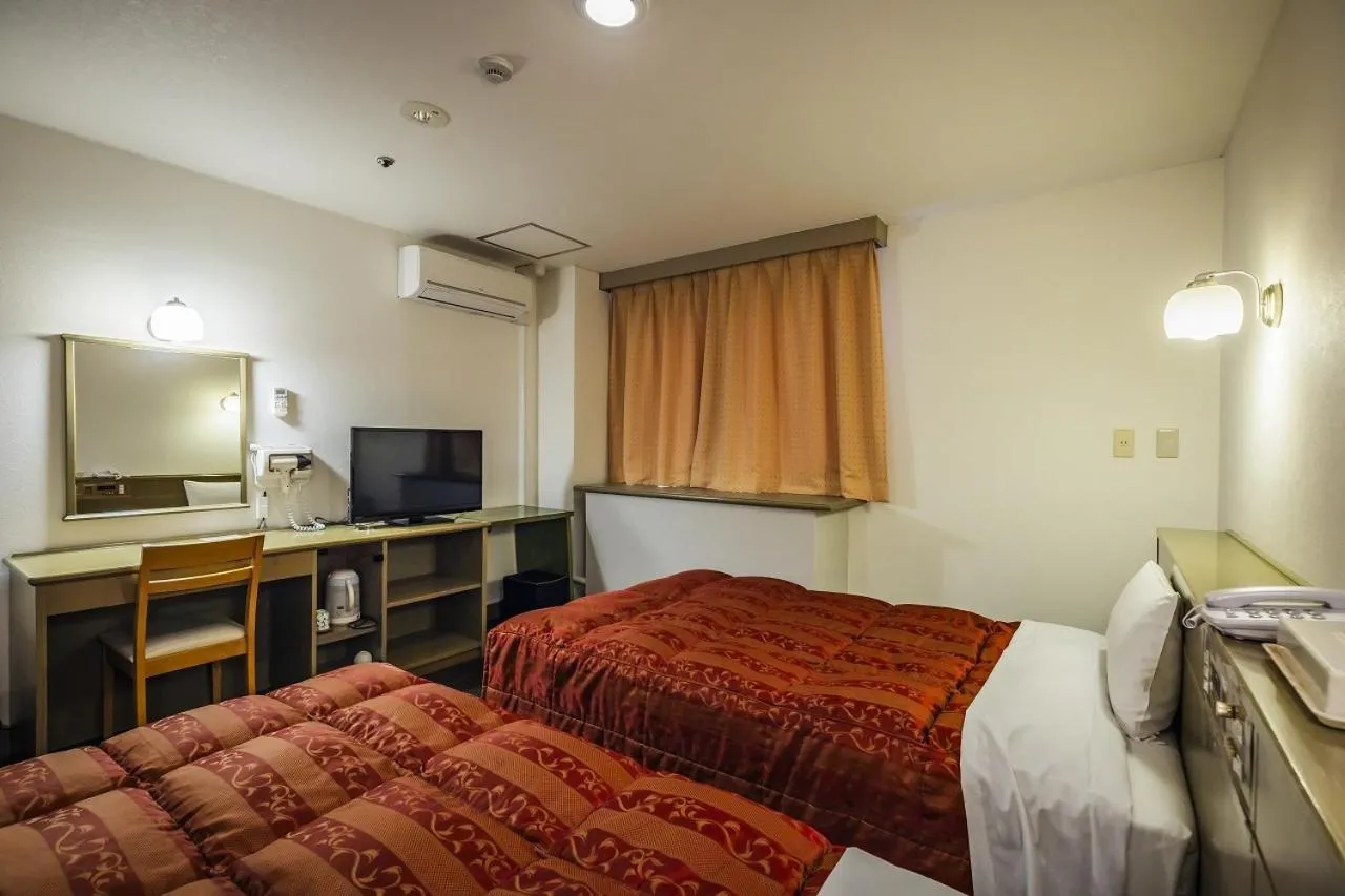 Bed in Asahi Century Hotel