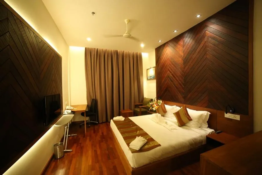 Bed in Woodies Bleisure Hotel