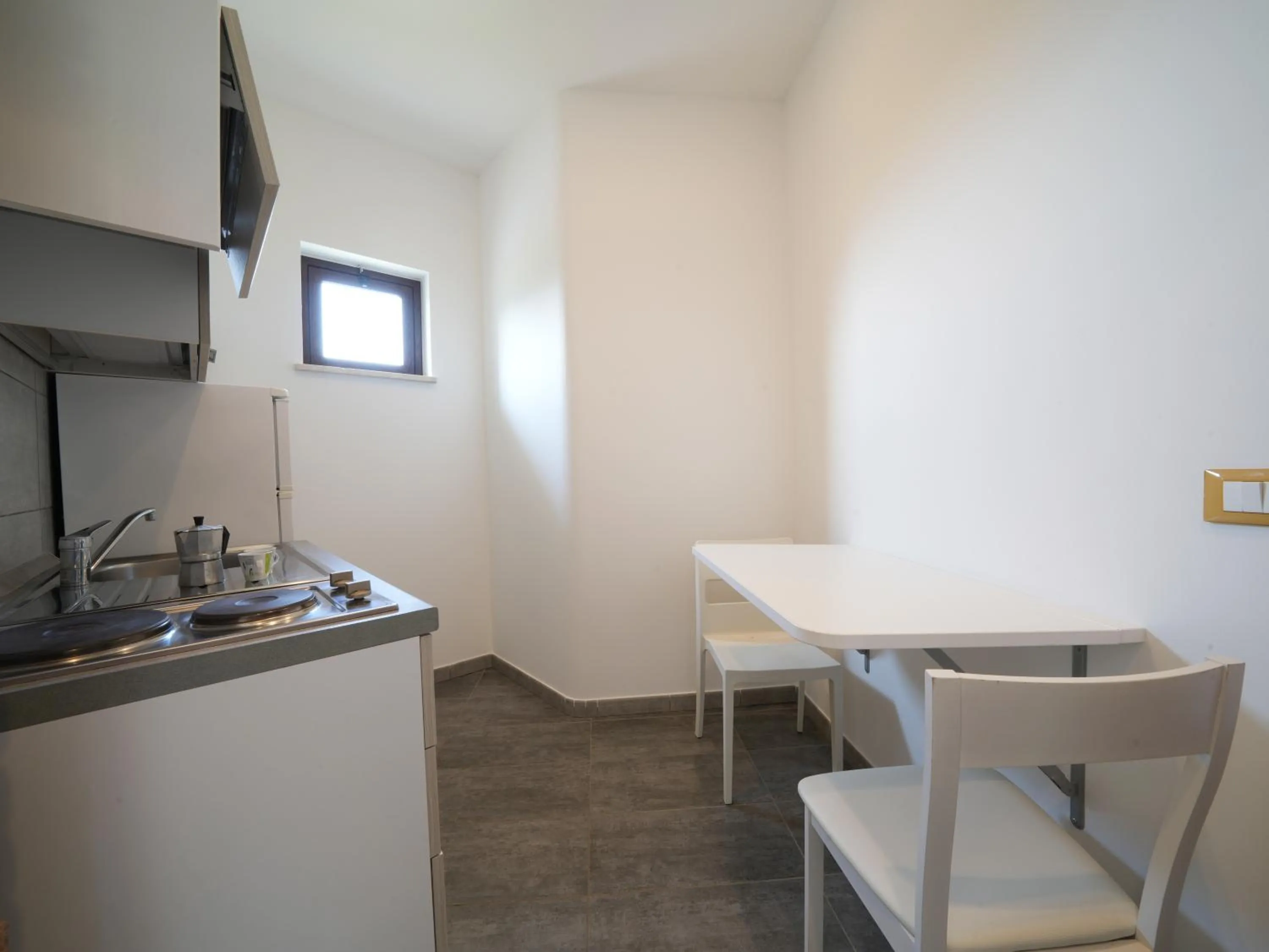 Kitchen or kitchenette in LUZIA AGRIRESORT - Piscina Idromassaggio con Vista Mare Aperta fino alle ore 23-00