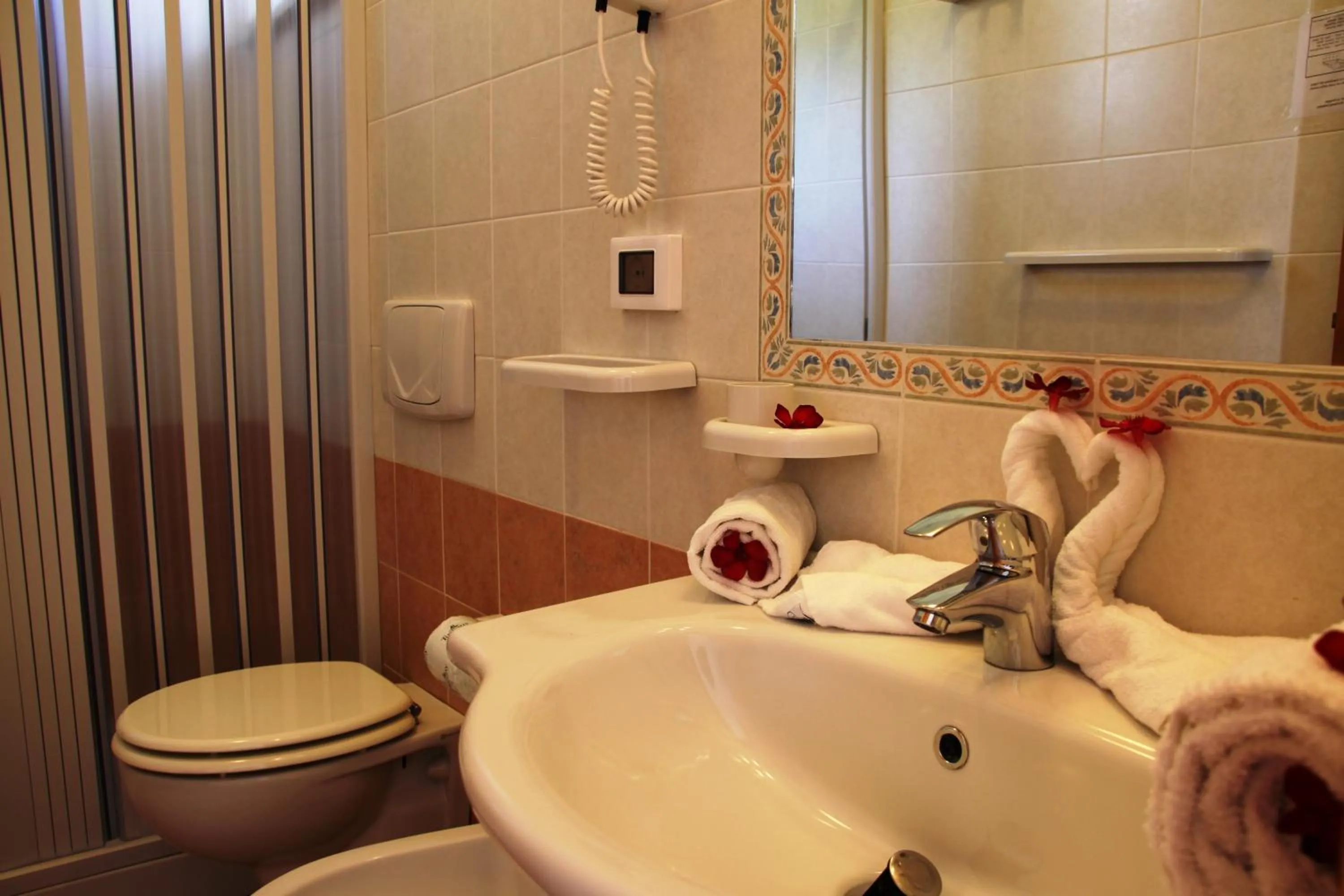 Bathroom in LUZIA AGRIRESORT - Piscina Idromassaggio con Vista Mare Aperta fino alle ore 23-00