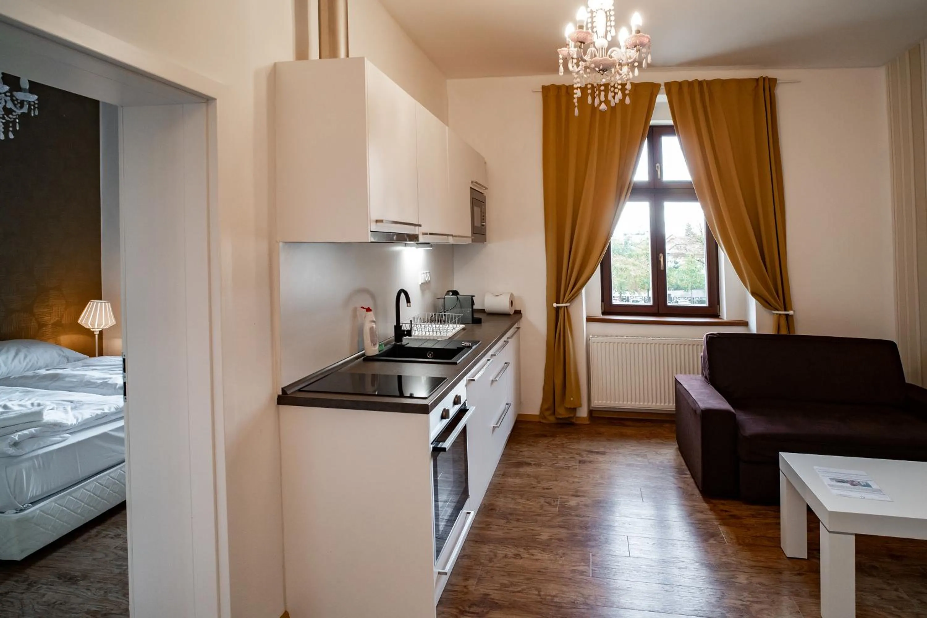Kitchen or kitchenette, Bed in Apartmany Pisek