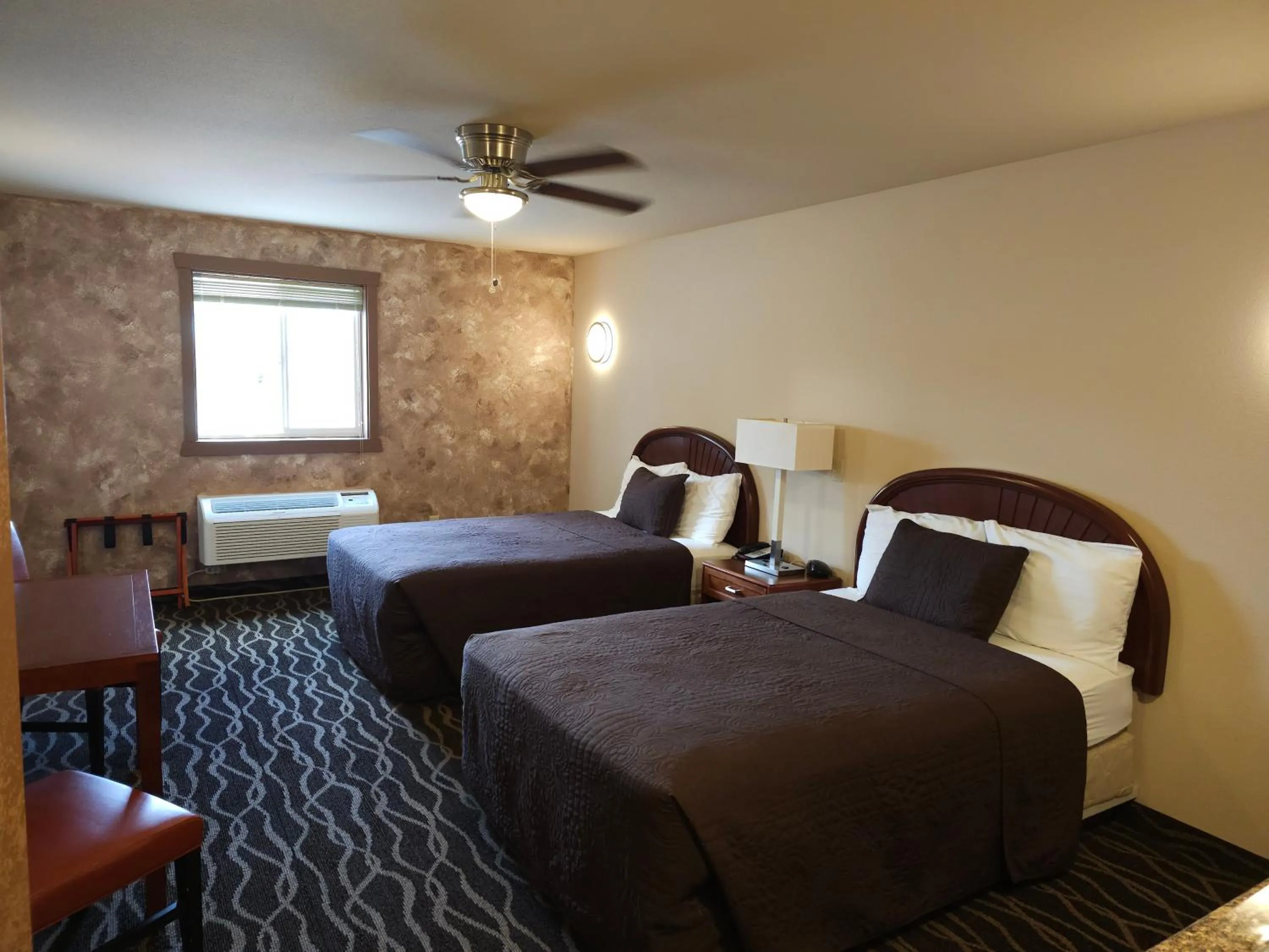 Bed in The Sunset Inn