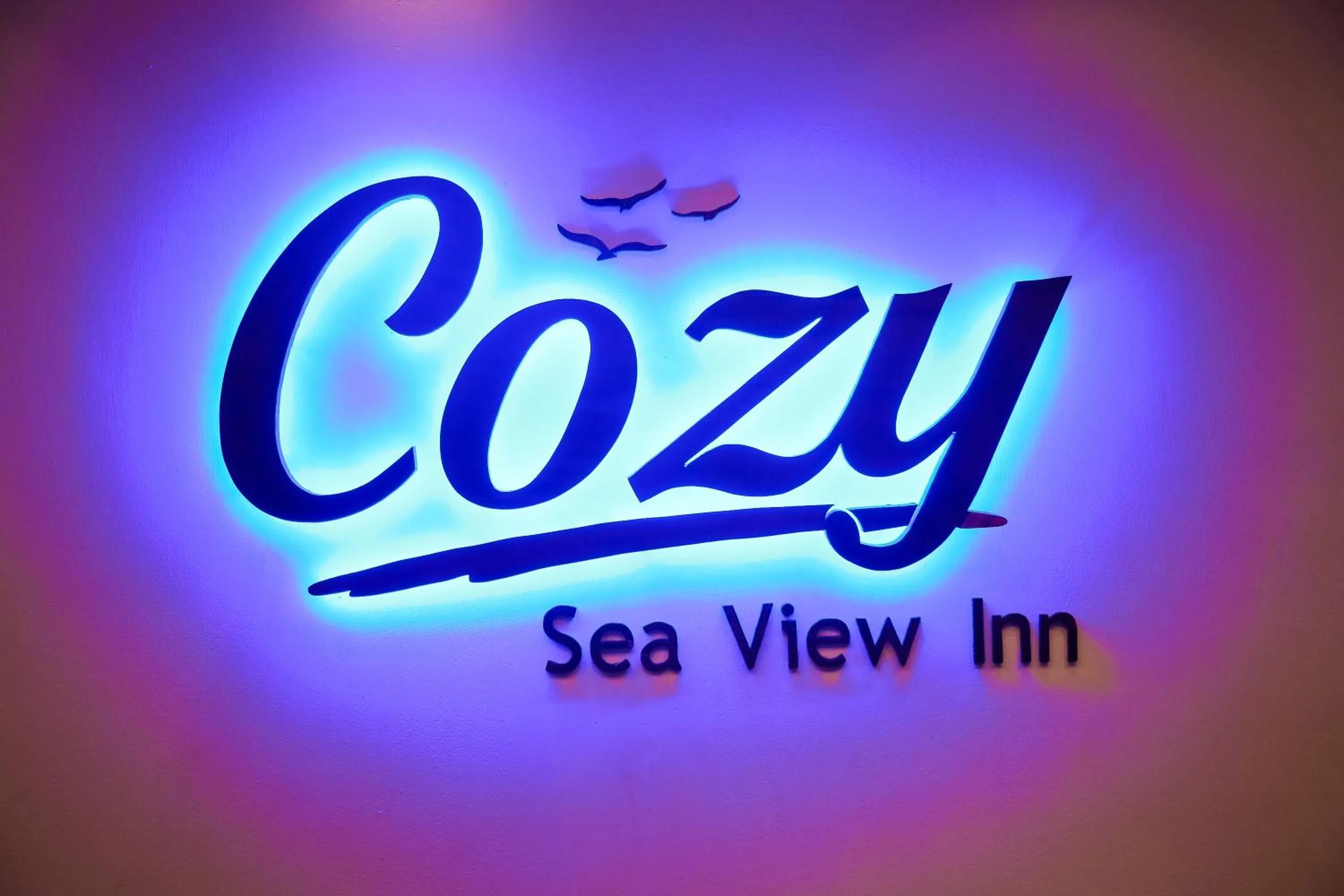 Property logo or sign in Cozy Sea view Inn