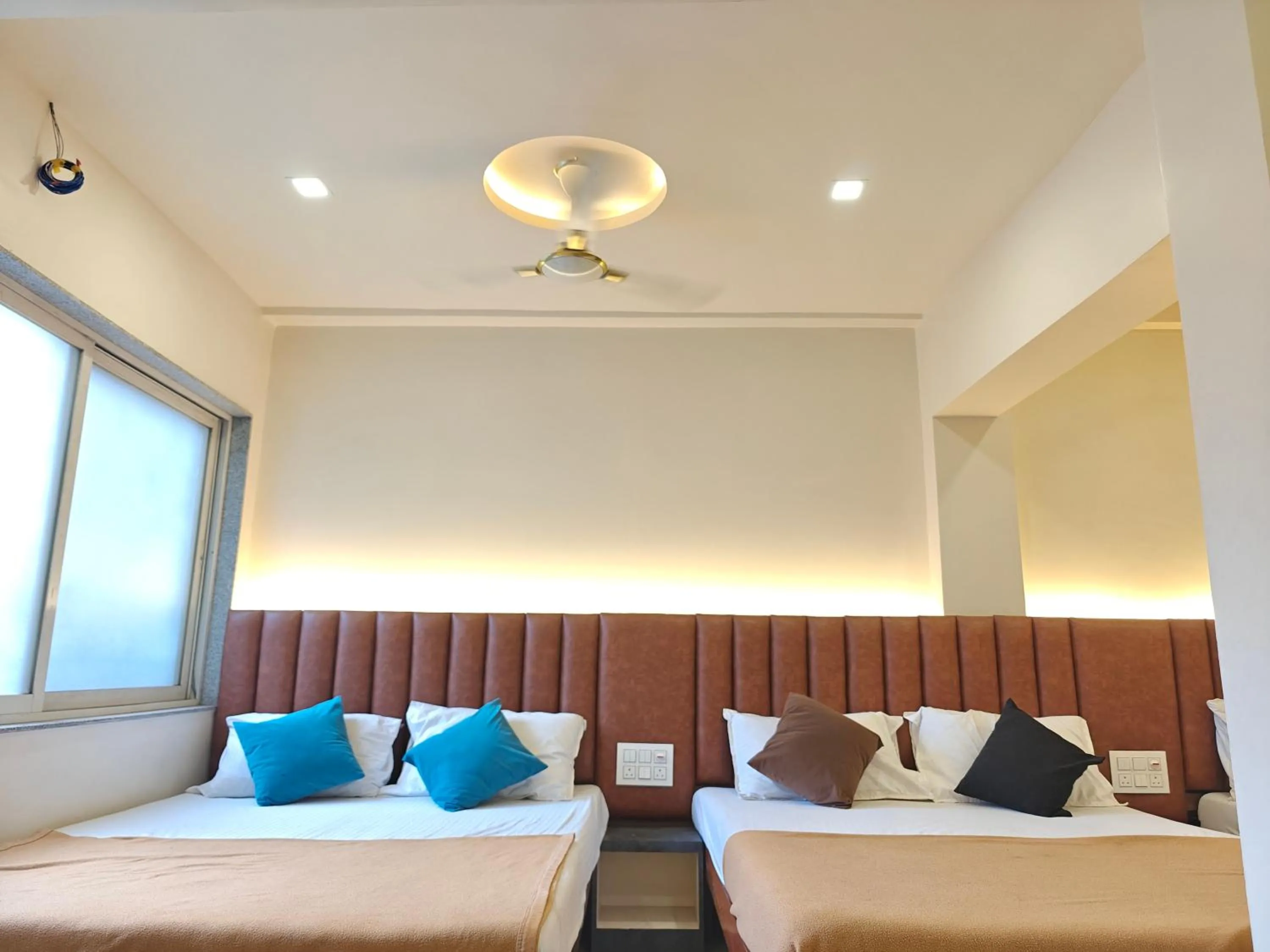 Bed in Central Inn, Kolhapur