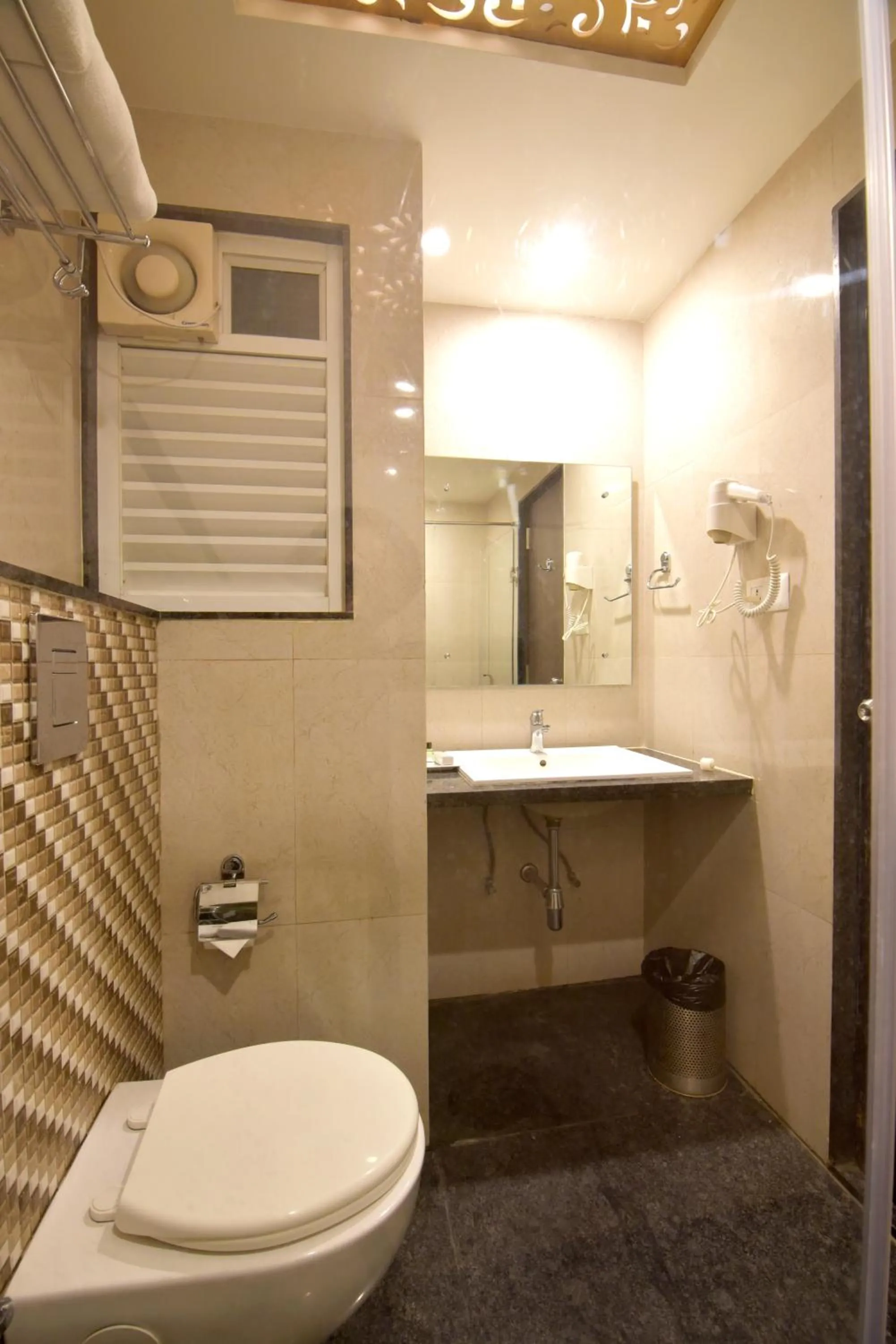 Toilet in I V Sanctum Hotel