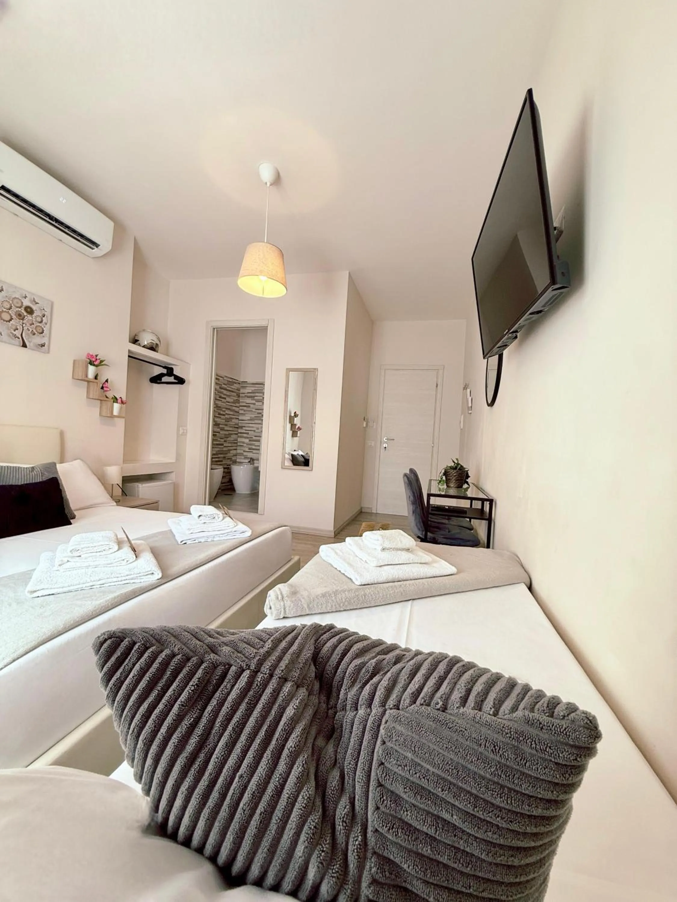 Bed in San Pietro Rooms 84