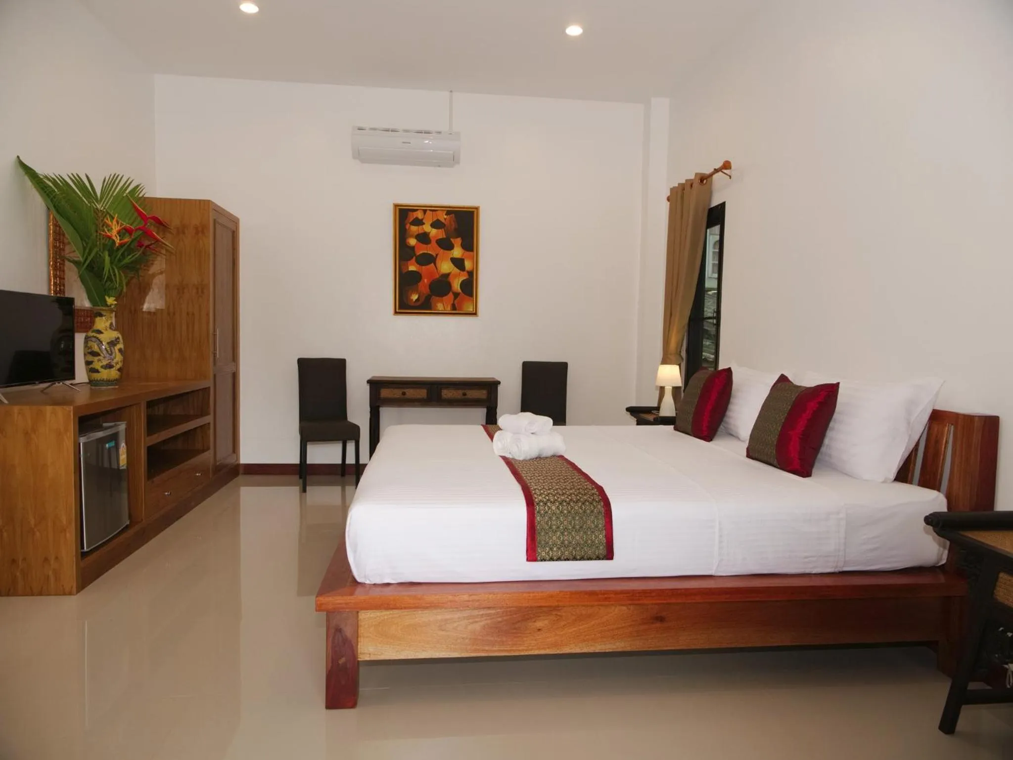 Living room, Bed in Chanapha Residence