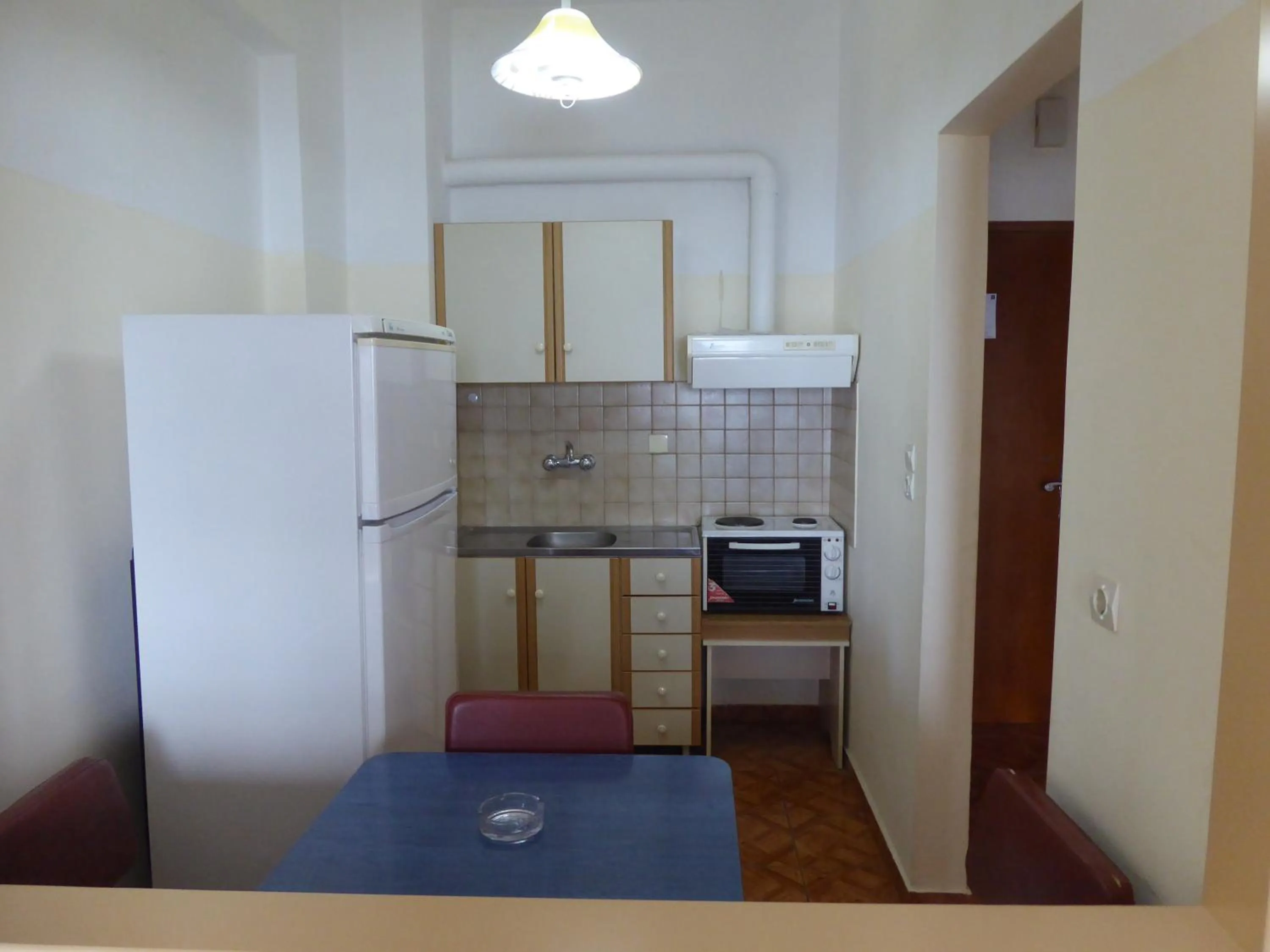 Kitchen or kitchenette in Poseidon Hotel