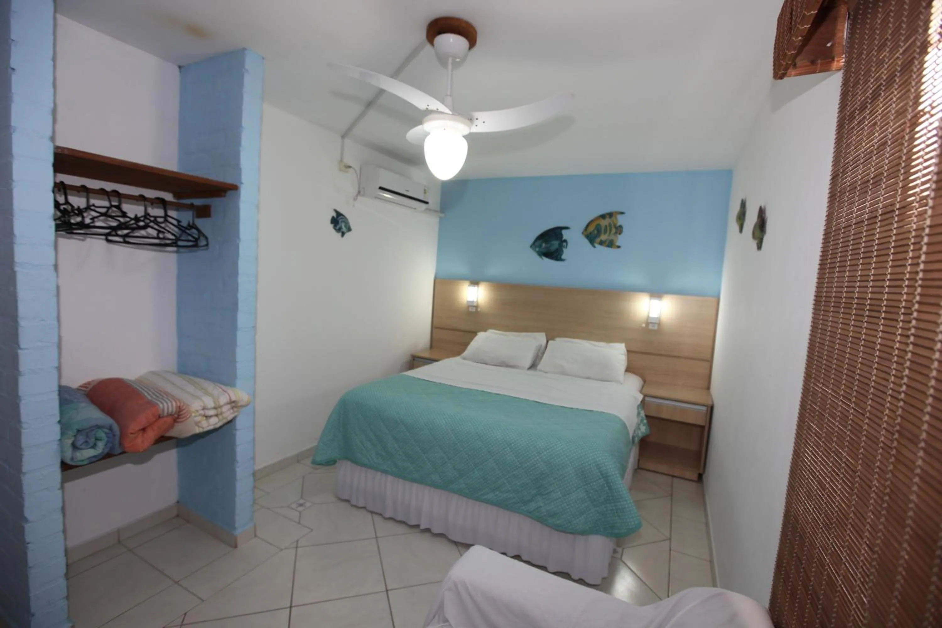 Bed in Pousada Hibisco