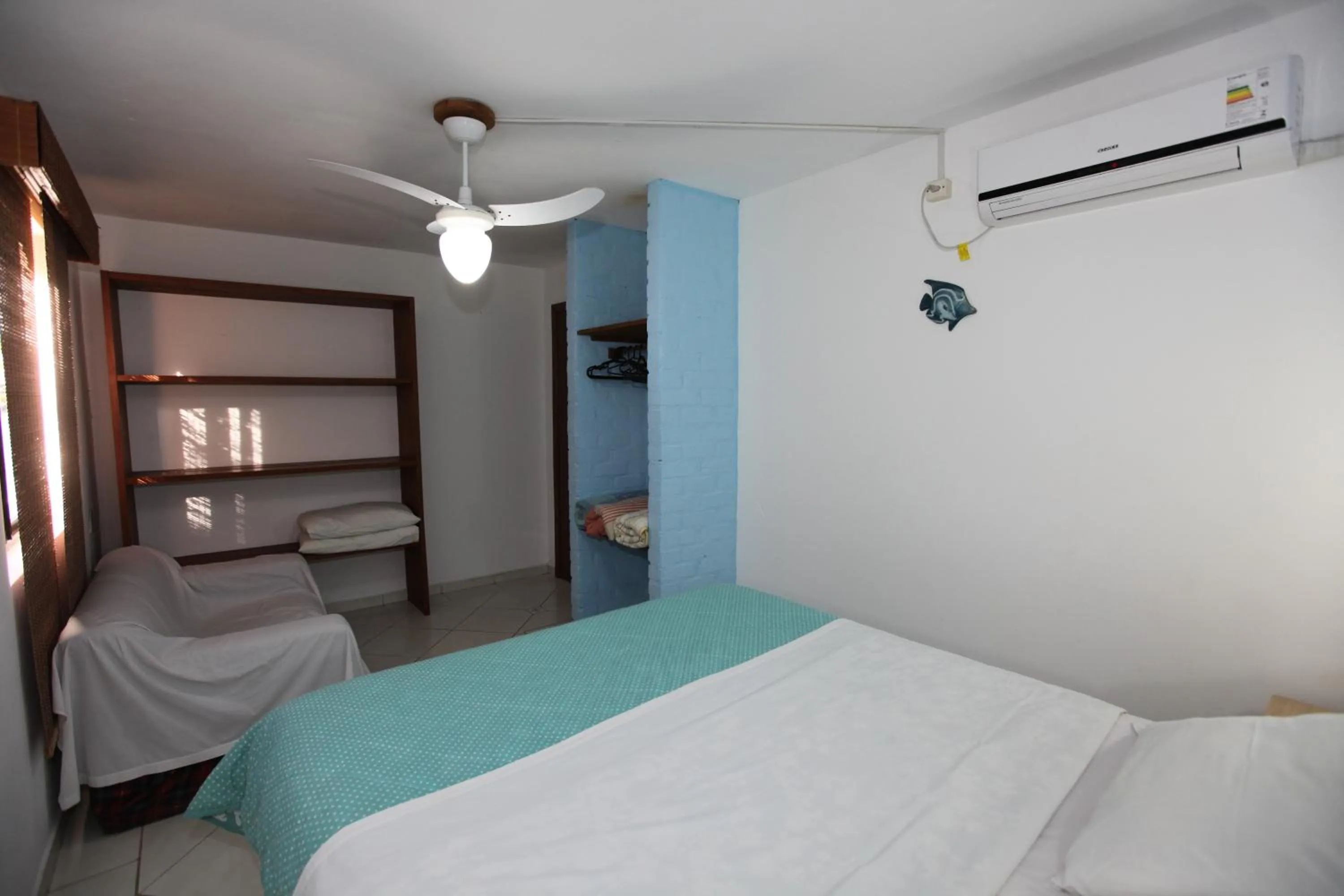 Bed in Pousada Hibisco