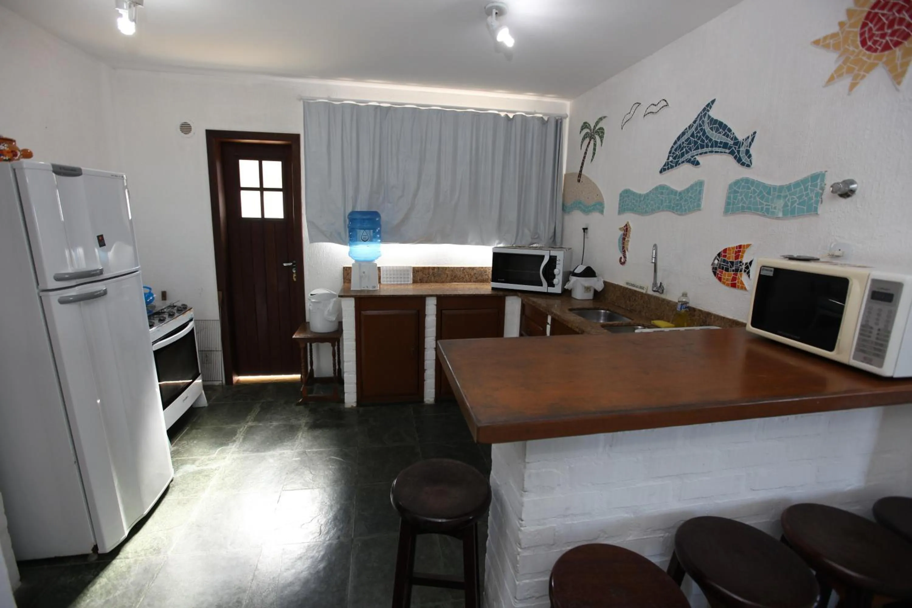 Kitchen or kitchenette in Pousada Hibisco