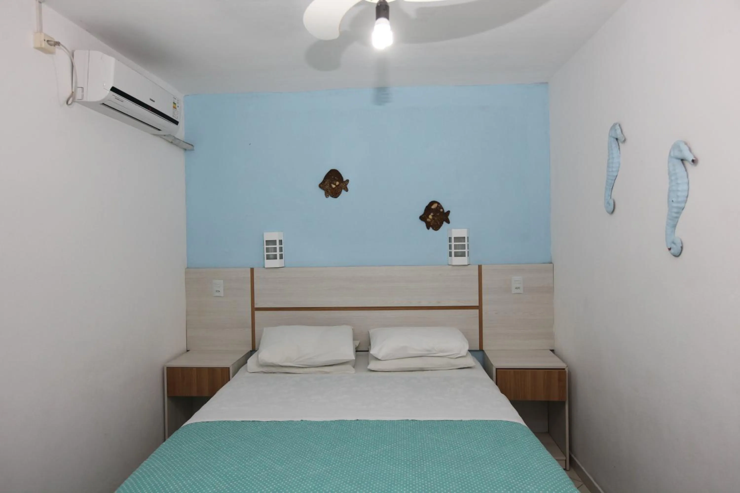 Bed in Pousada Hibisco