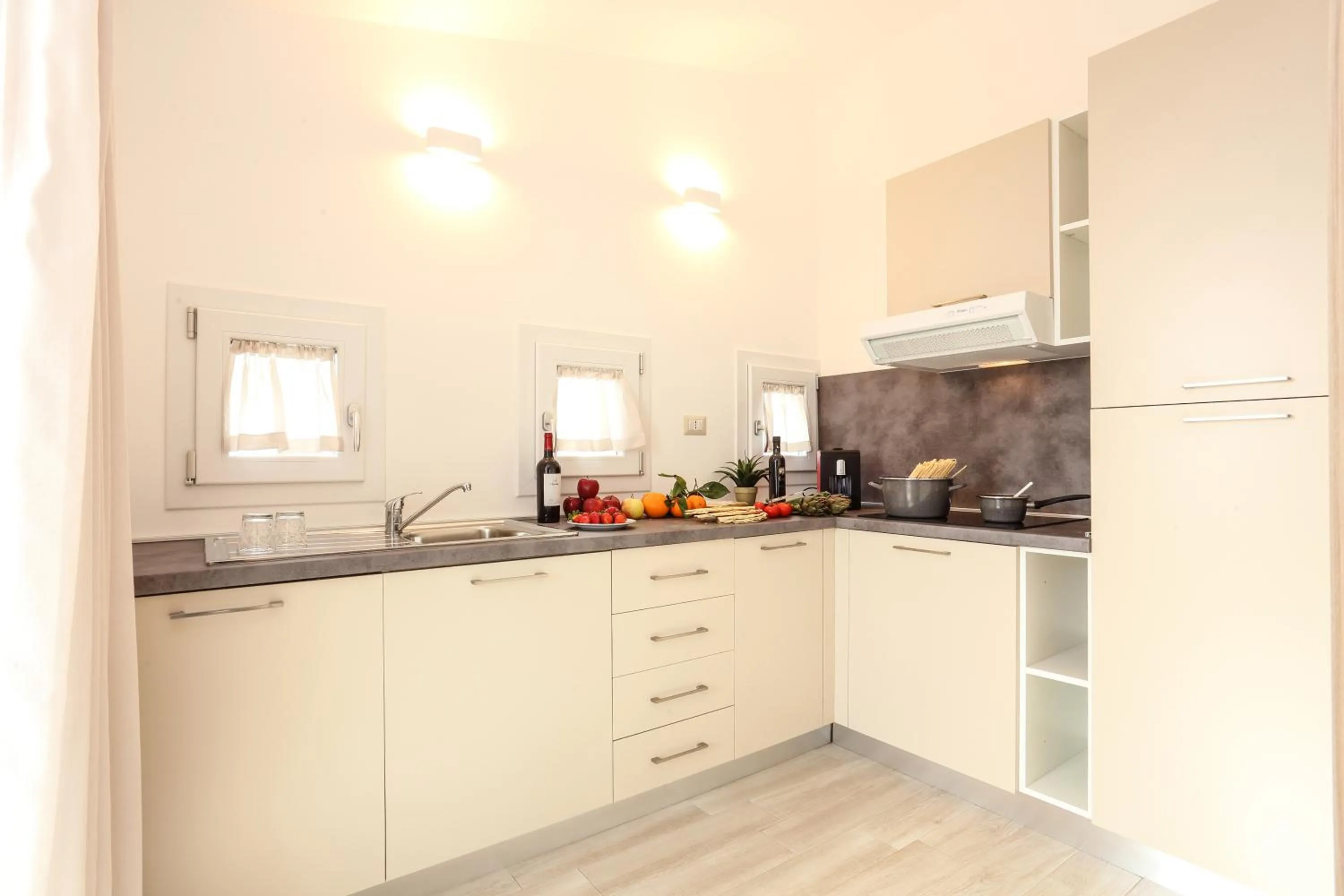 Kitchen or kitchenette in Alma di Alghero Apartments