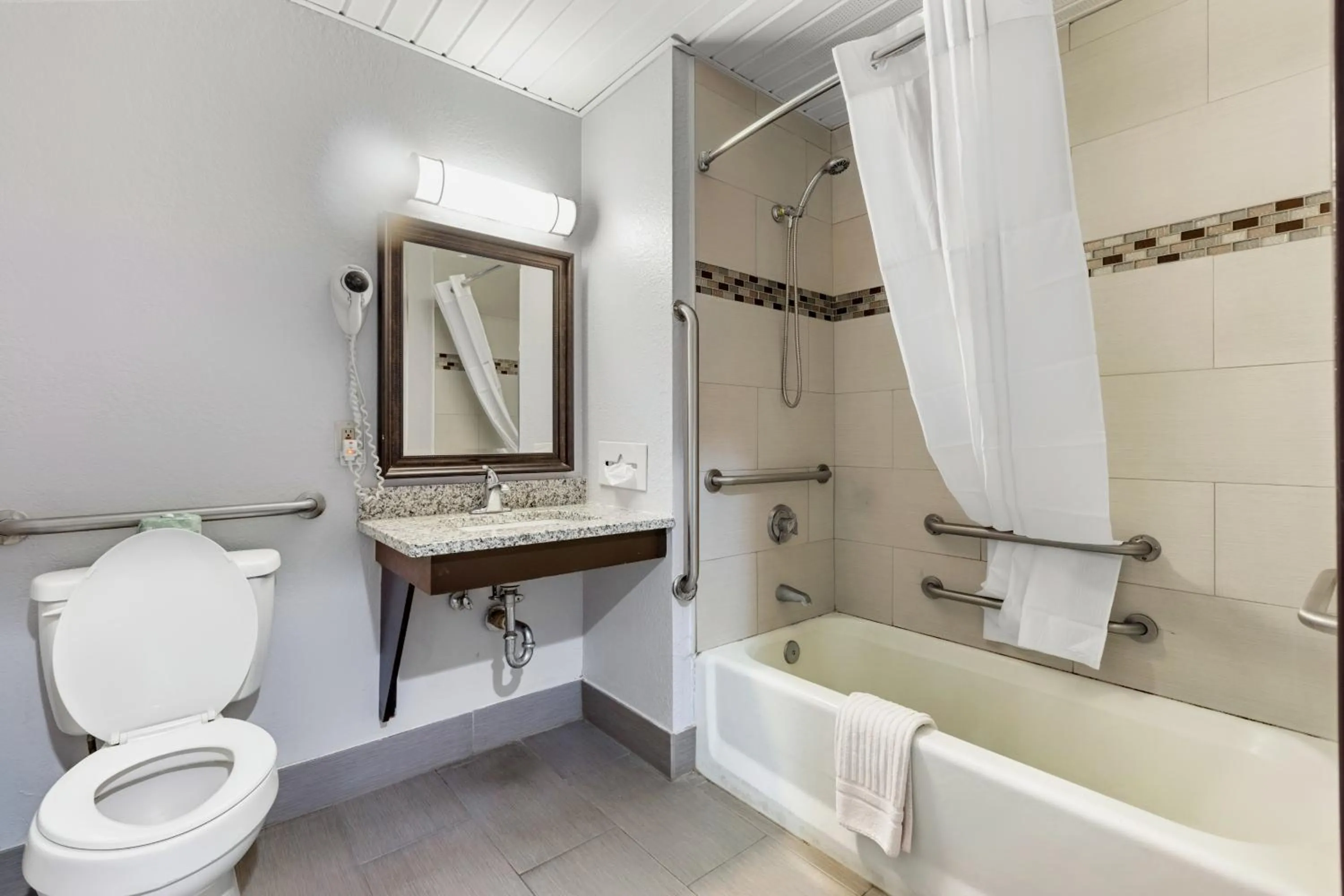 Bathroom in Days Inn by Wyndham Savannah Gateway I-95