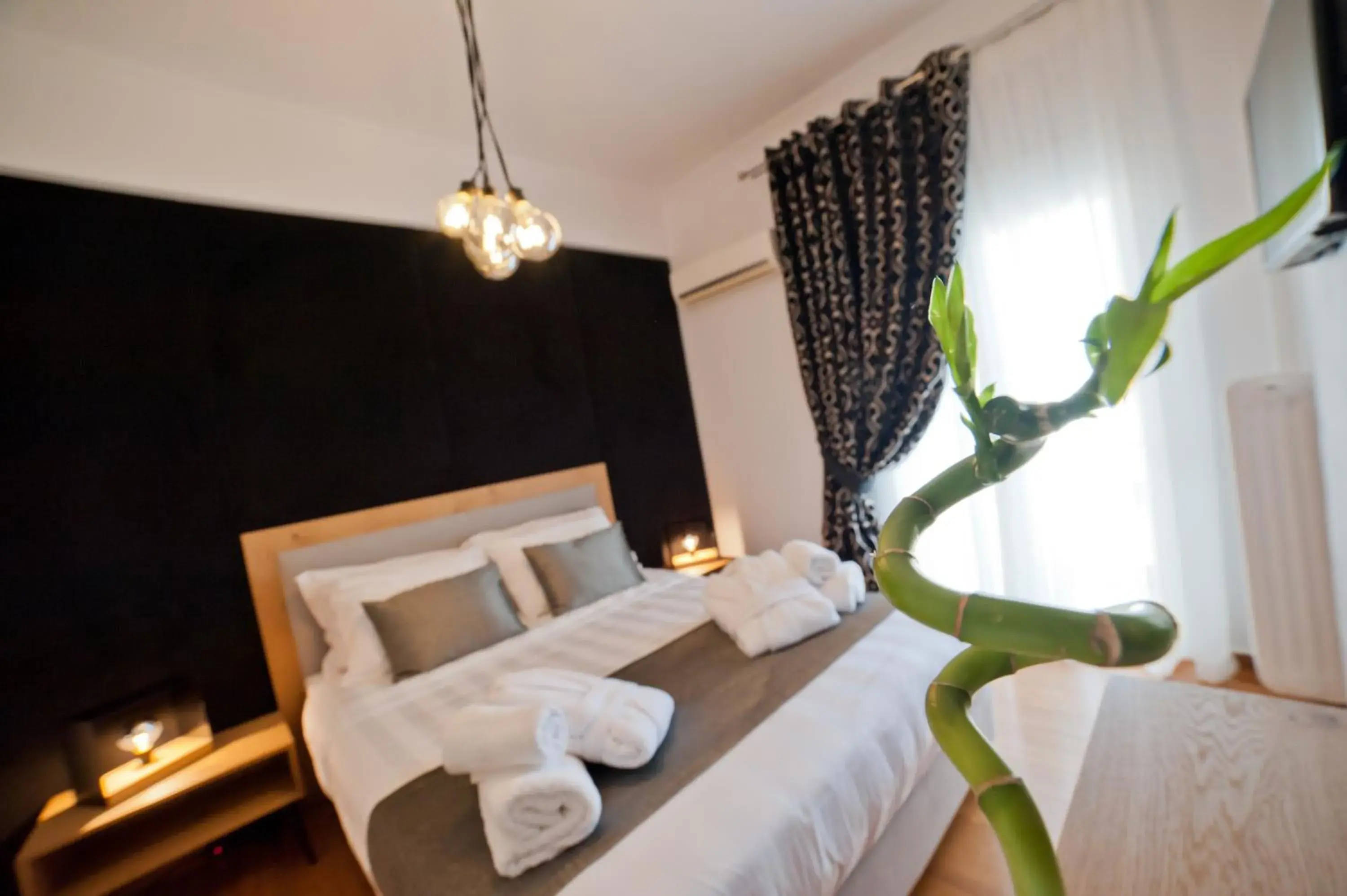 Bed in Acropolis View Deluxe Penthouse & Luxury Apartments Bed in Acropolis View Deluxe Penthouse & Luxury Apartments