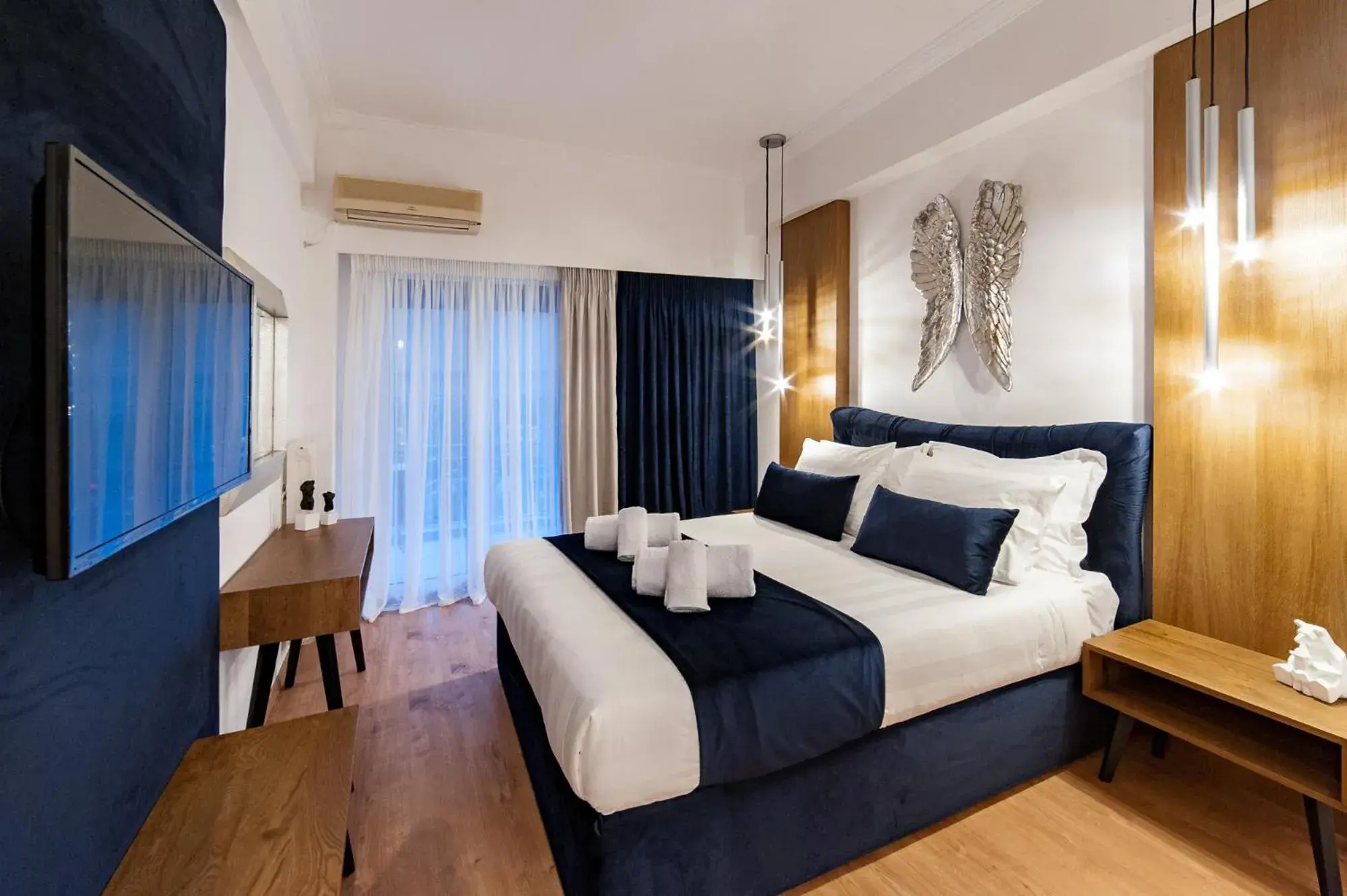 Bed in Acropolis View Deluxe Penthouse & Luxury Apartments Bed in Acropolis View Deluxe Penthouse & Luxury Apartments