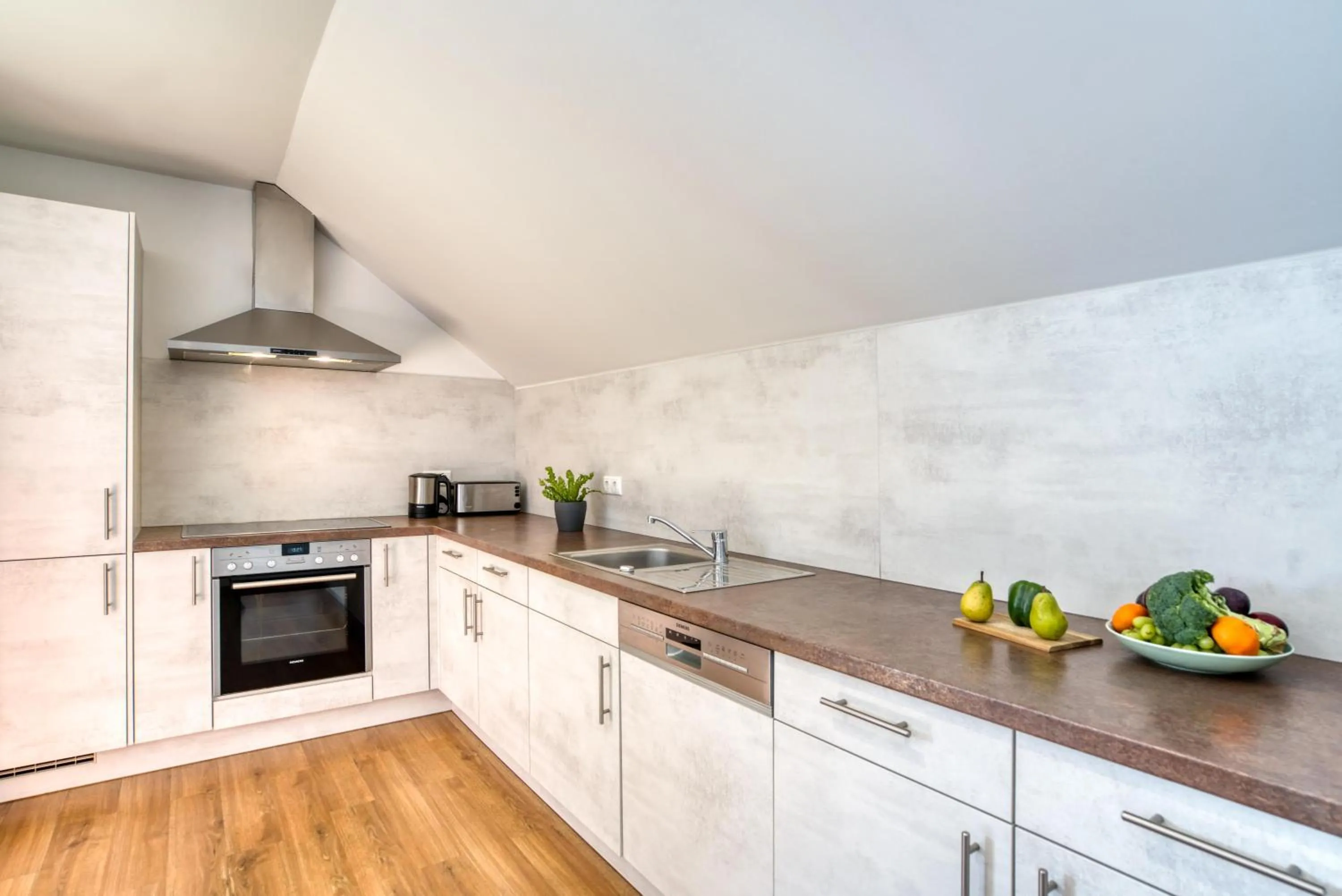 Kitchen or kitchenette in COOEE alpin Hotel Dachstein