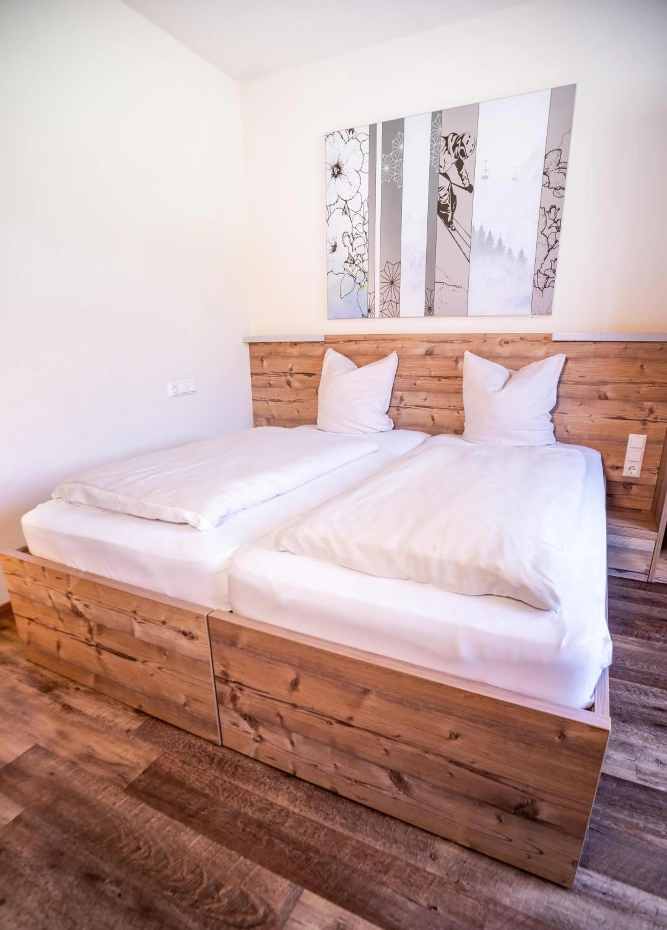 Bed in COOEE alpin Hotel Dachstein