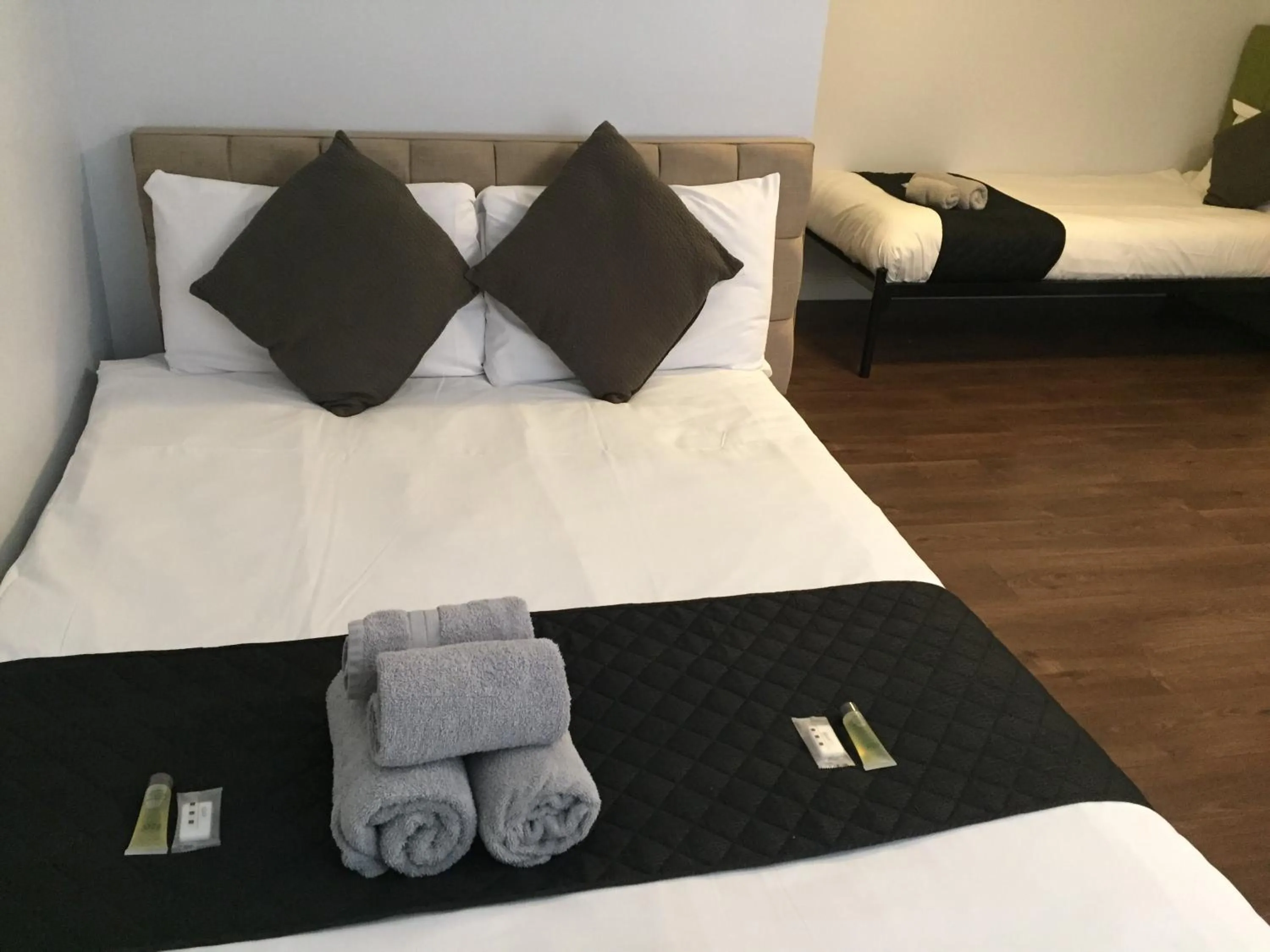 Bed in Queens Guesthouse Manchester