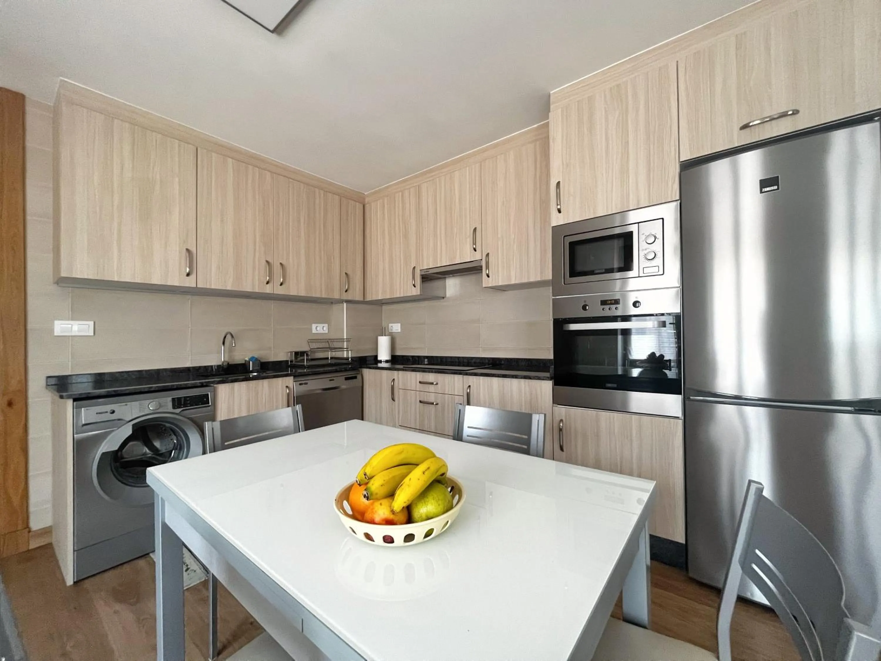 Kitchen or kitchenette in Apartamentos Valbuena