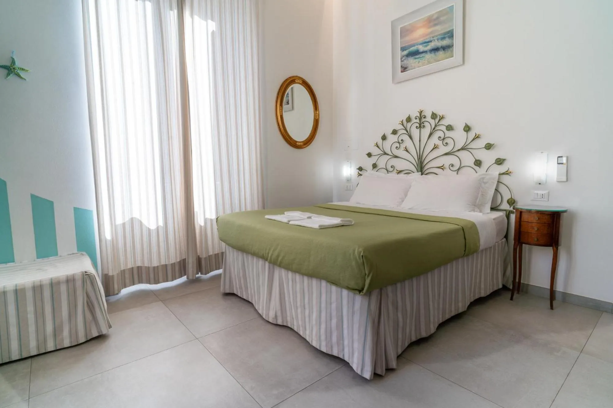 Bed in Teresa Rooms & Suites