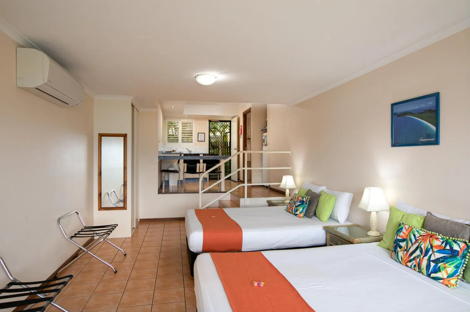 Bed in Sunlit Waters Studio Apartments