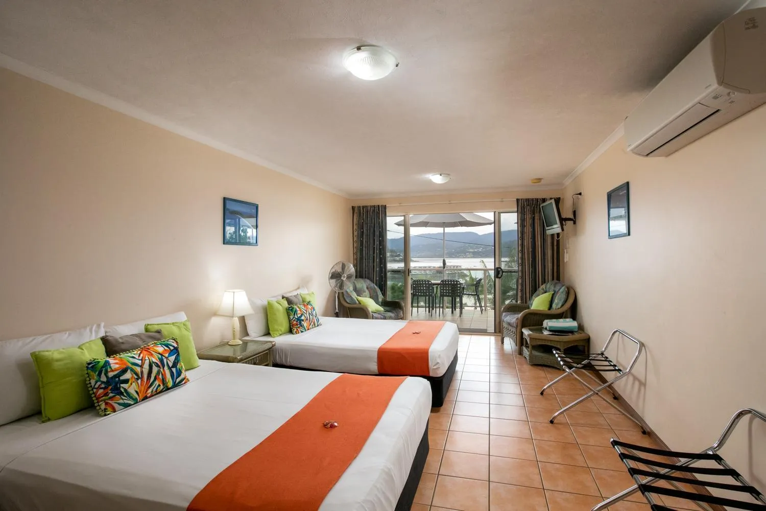 Bed in Sunlit Waters Studio Apartments