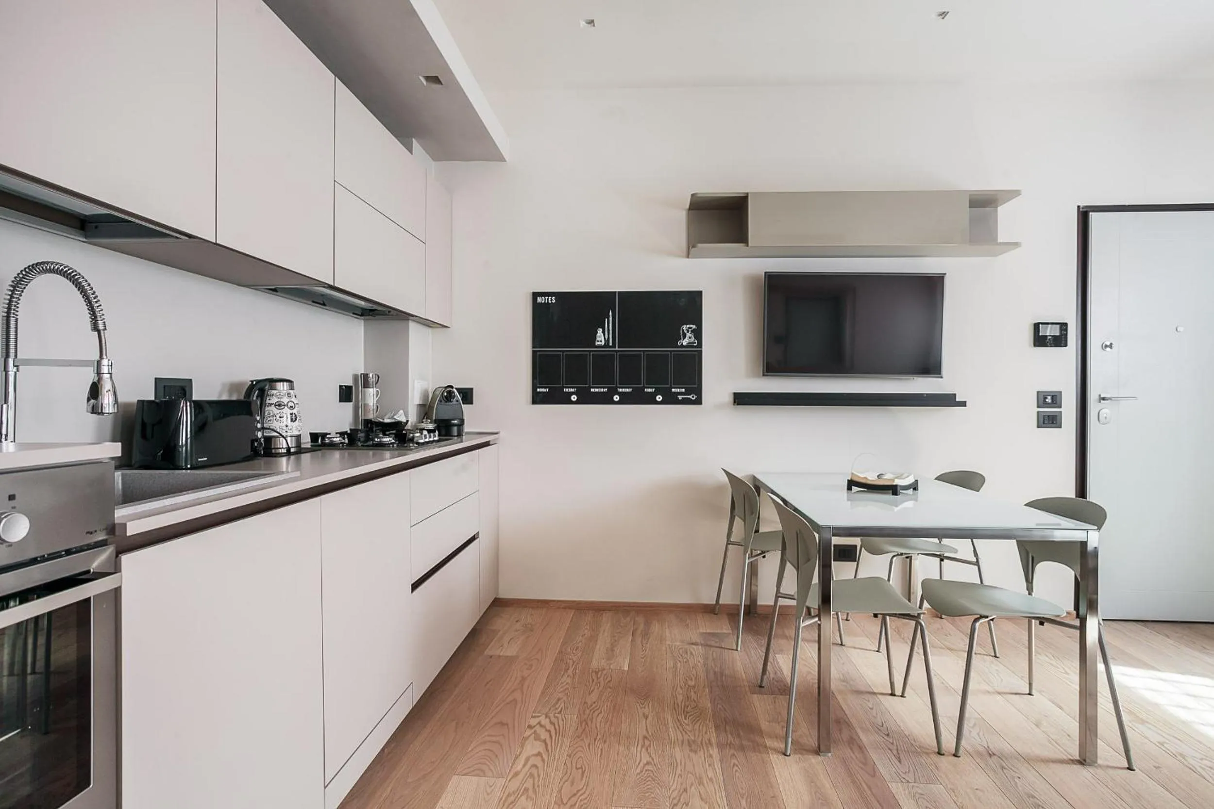Kitchen or kitchenette in Residence Rizzoli-Suites Apartments