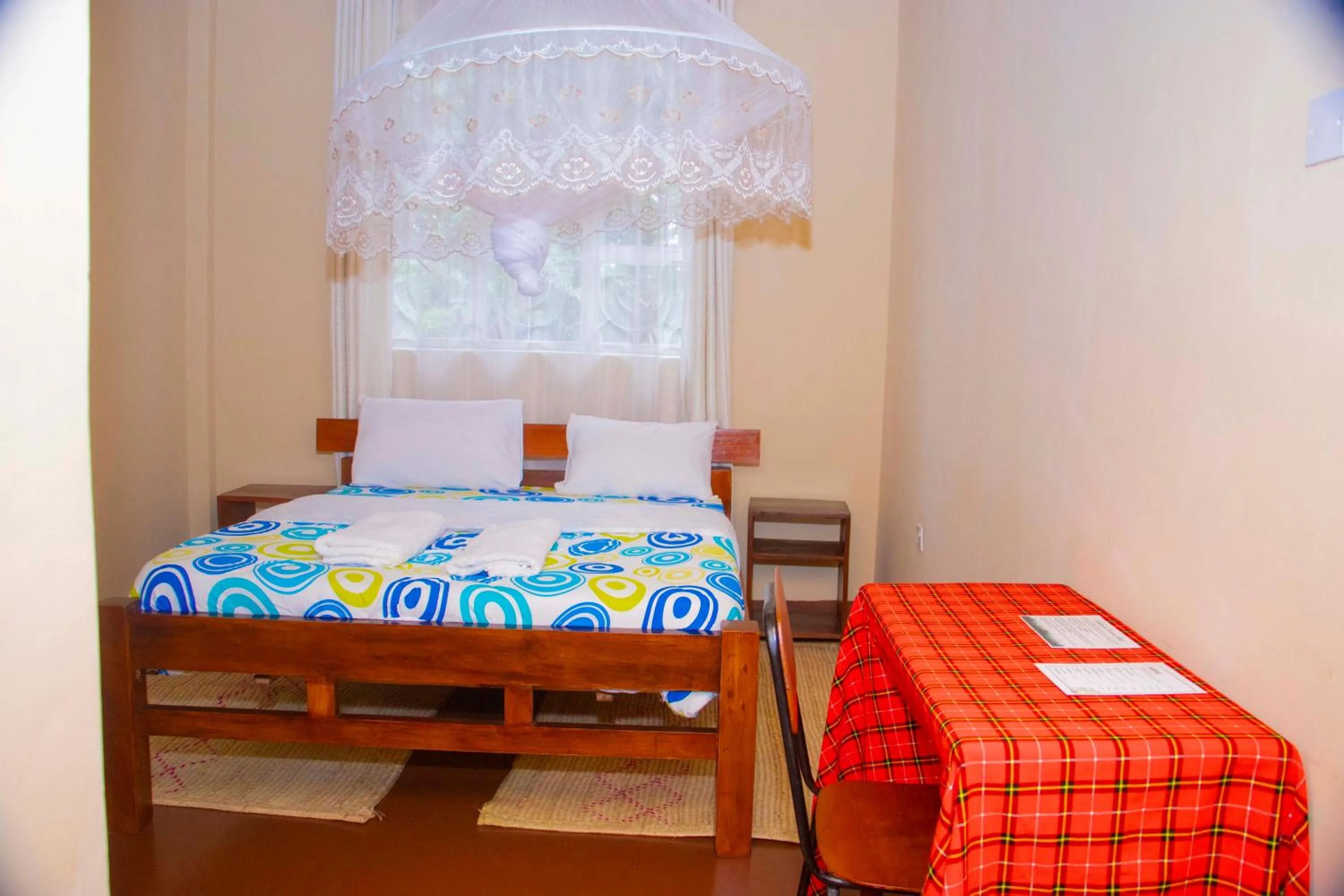 Bed in Endasawa Tree Lodge