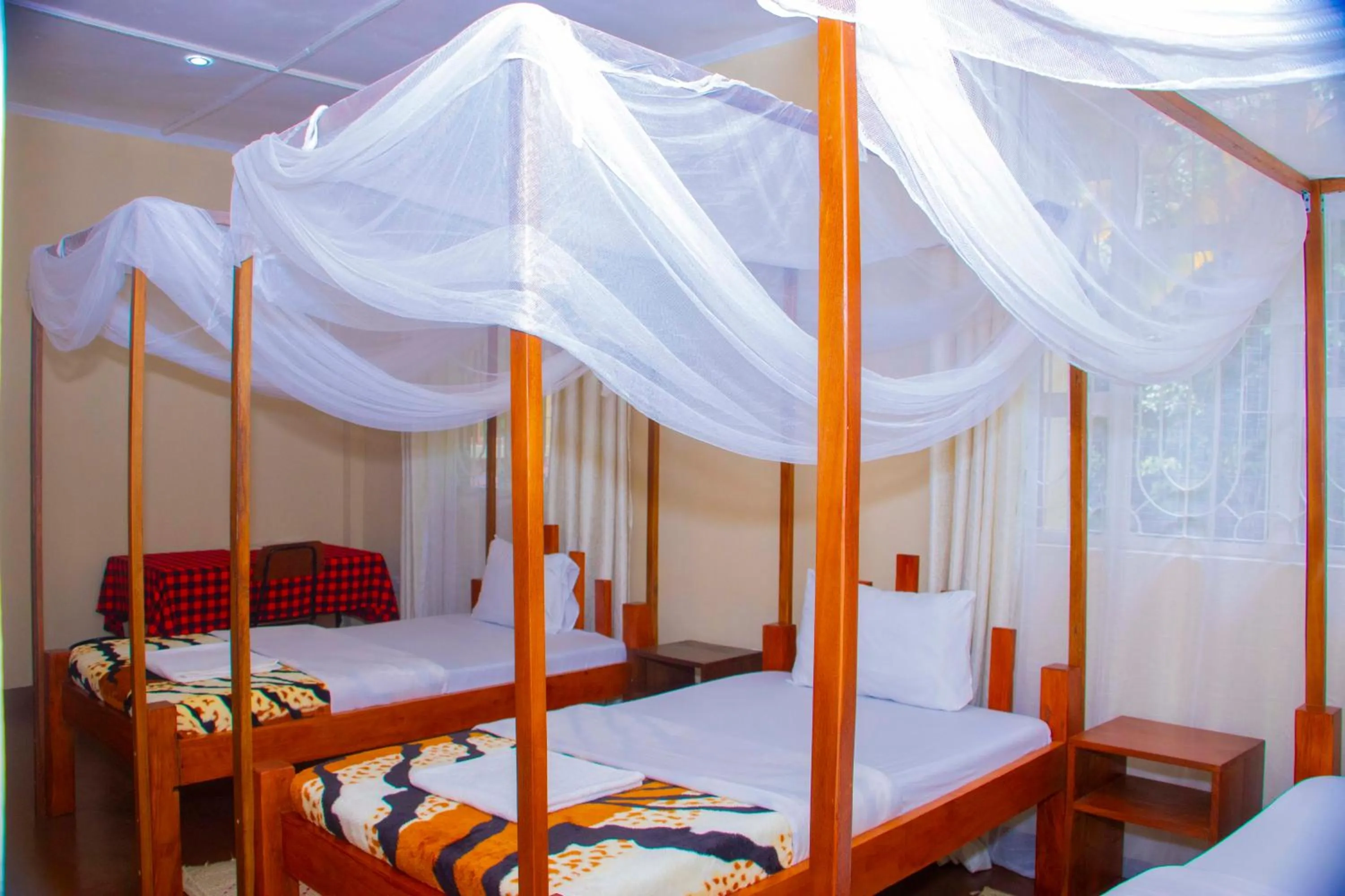 Bed in Endasawa Tree Lodge