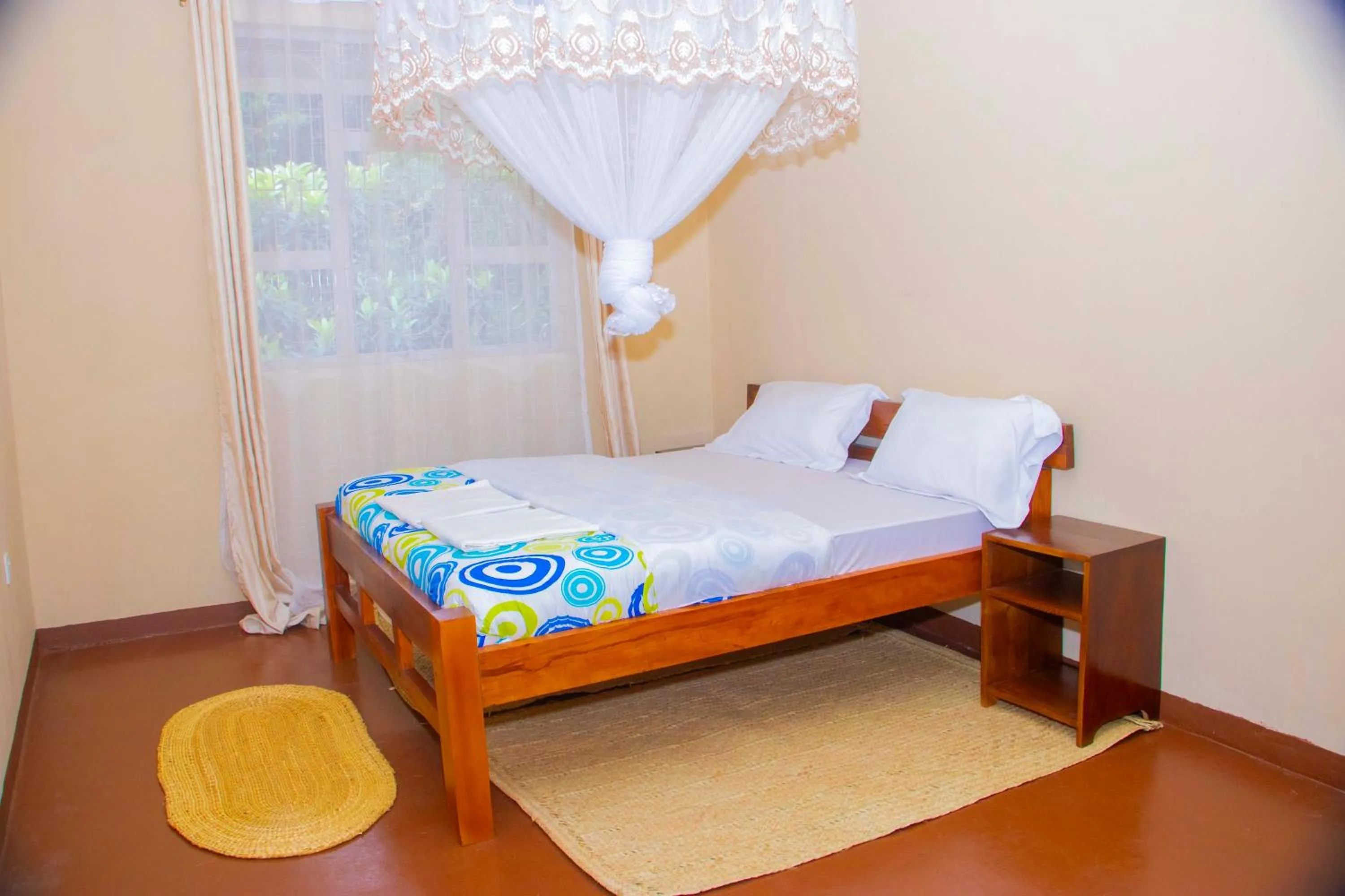 Bed in Endasawa Tree Lodge